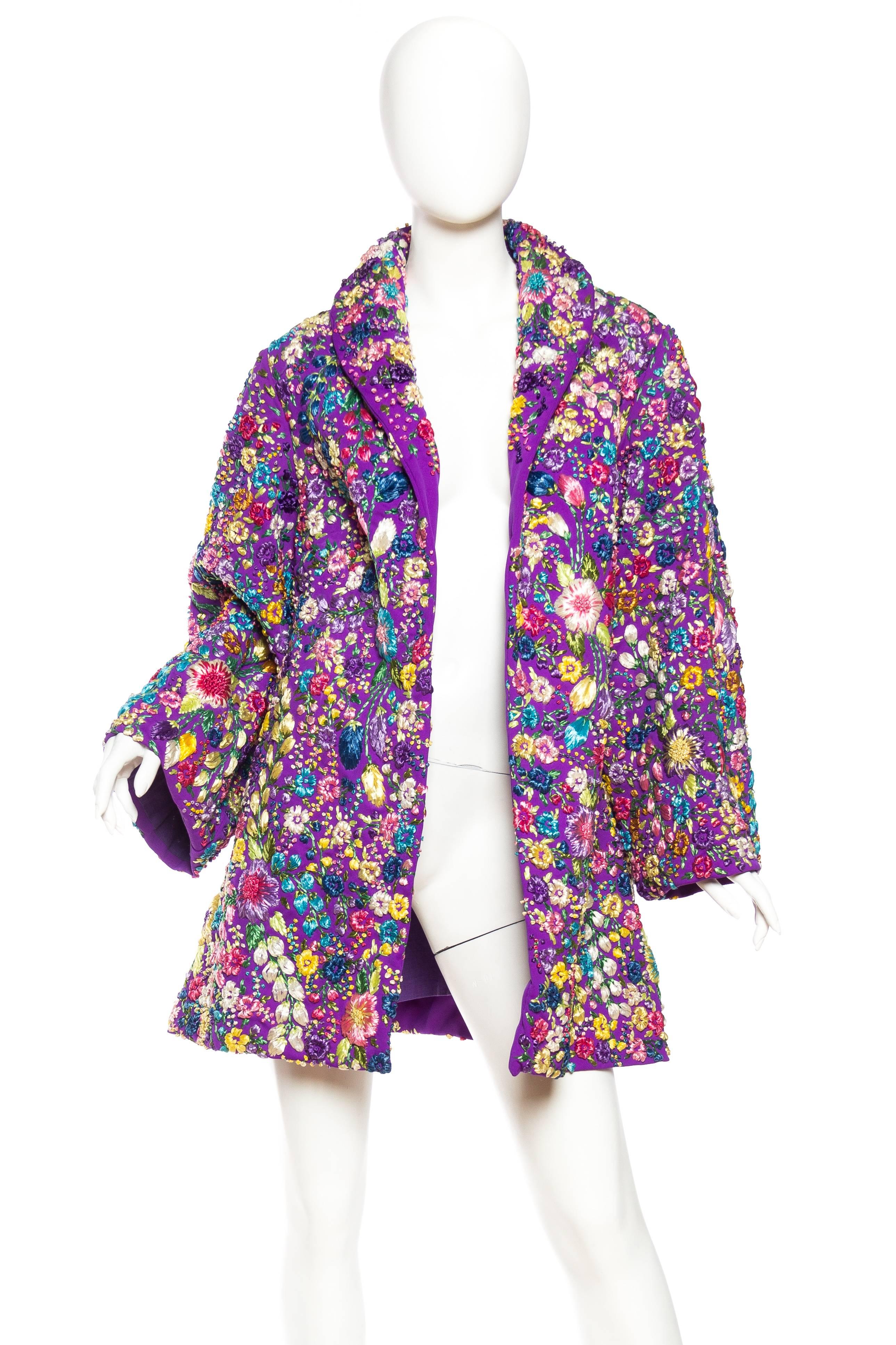 The wild abandon of the full on floral embroidery on this coat is stunning. 