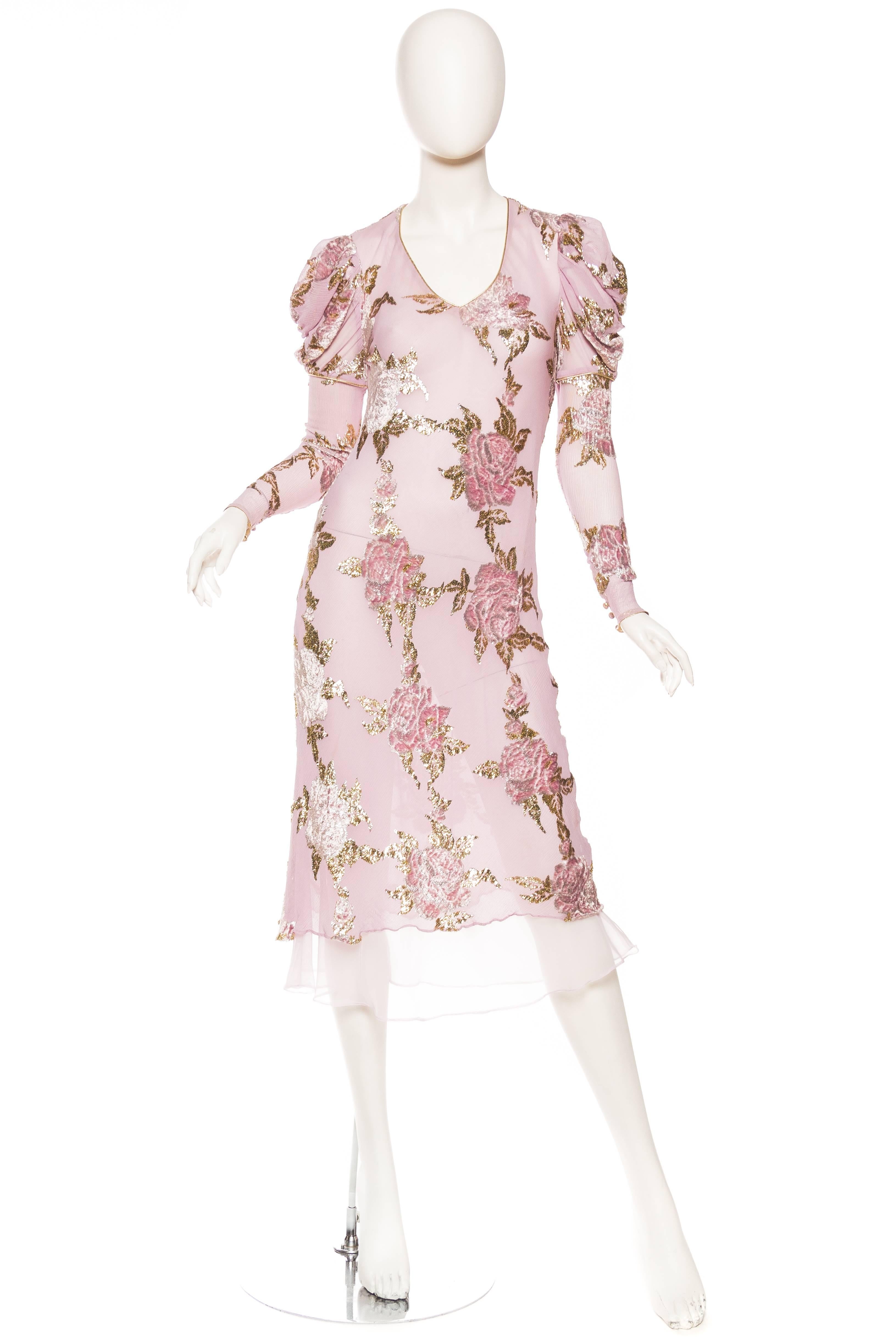 This beautifully made dress is a wonderful dress for the transition between seasons. Lightweight construction yet still warm enough to keep a chill away. The silk chiffon and velvet devoré fabric is cut on the bias in the style of Galliano and