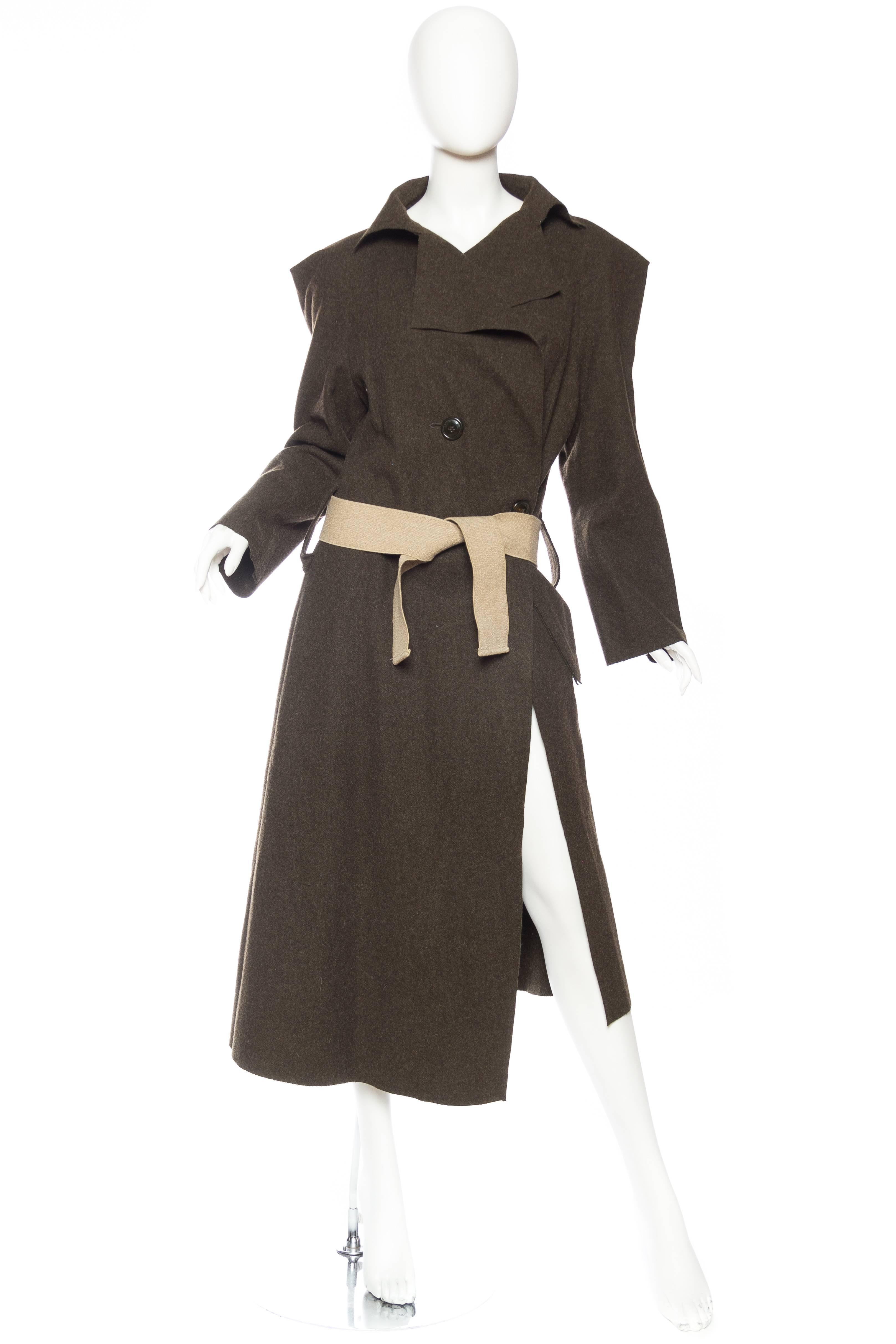 1990S VIVIENNE WESTWOOD Olive Green Wool Anglomania Asymmetrical Trench Coat With Elastic Tie Belt & Raw Hems