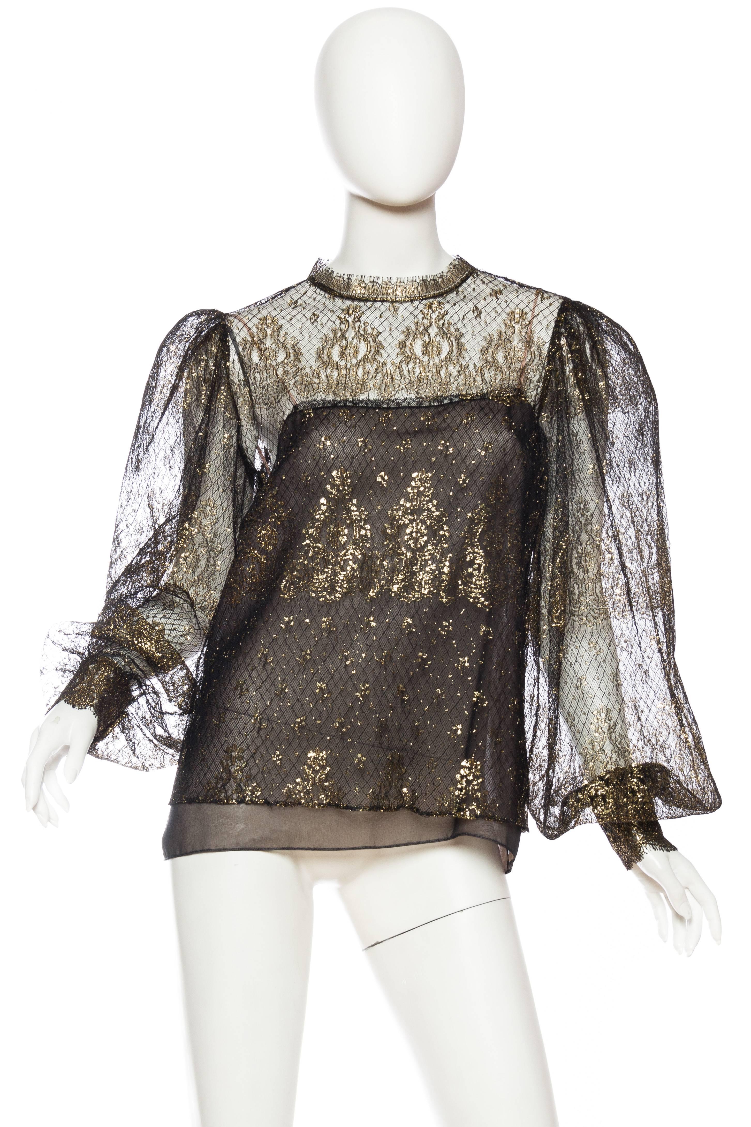 This delicate and luxurious silk lace blouse comes with an interior silk cami. 