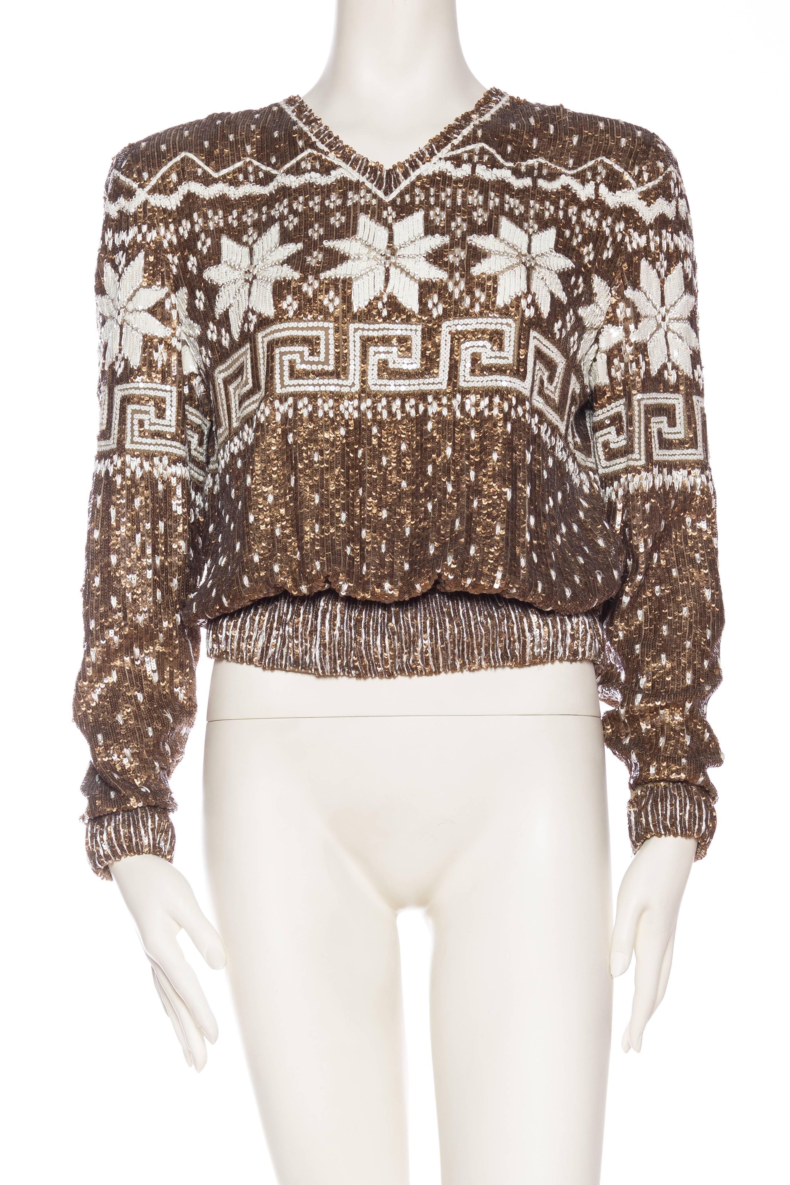 Beautiful beadwork on silk chiffon to resemble the chicest winter sweater. 