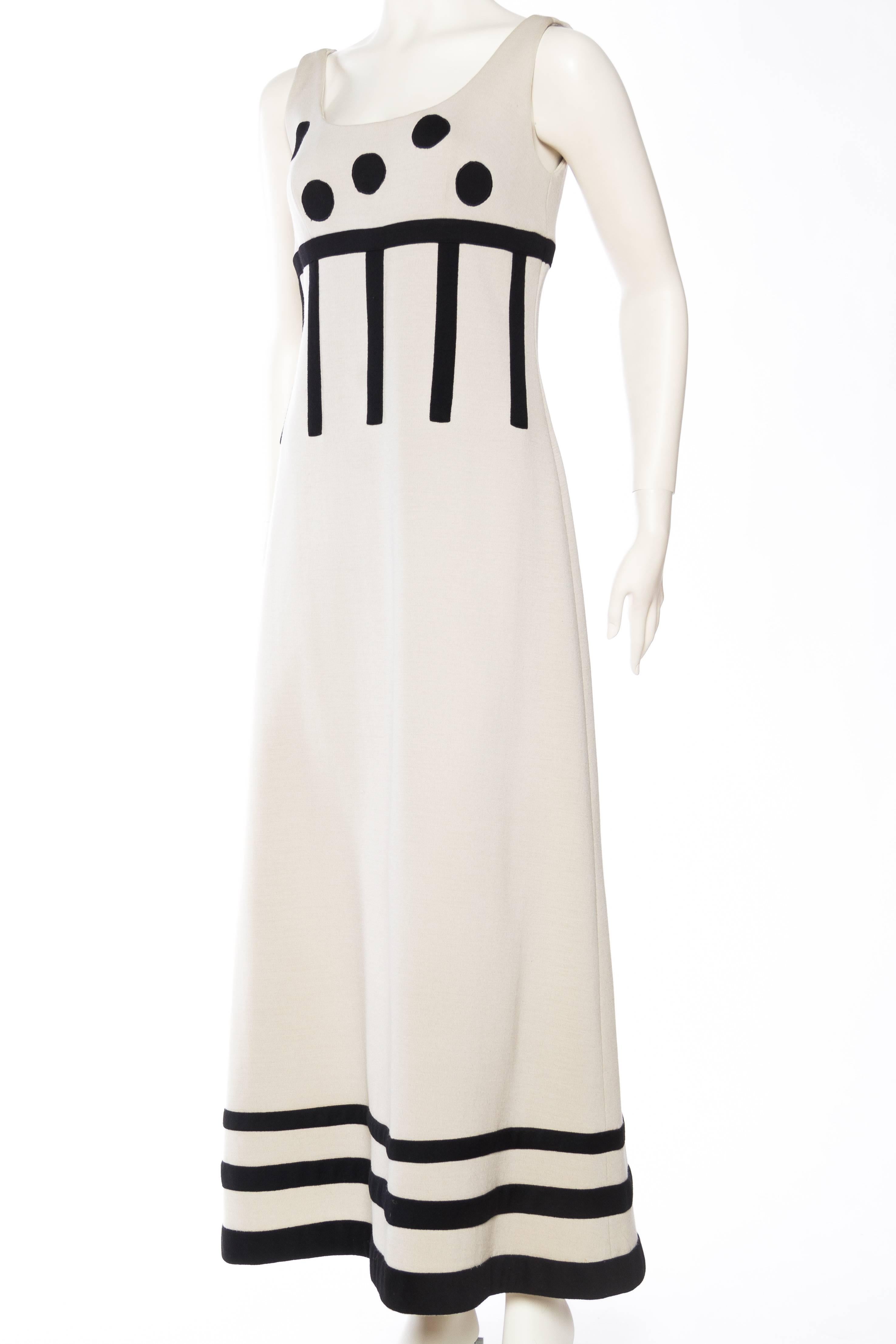 Wool knit has been expertly pieced together to create this dress in a design which is both figure enhancing as well as chic. Fully lined. 