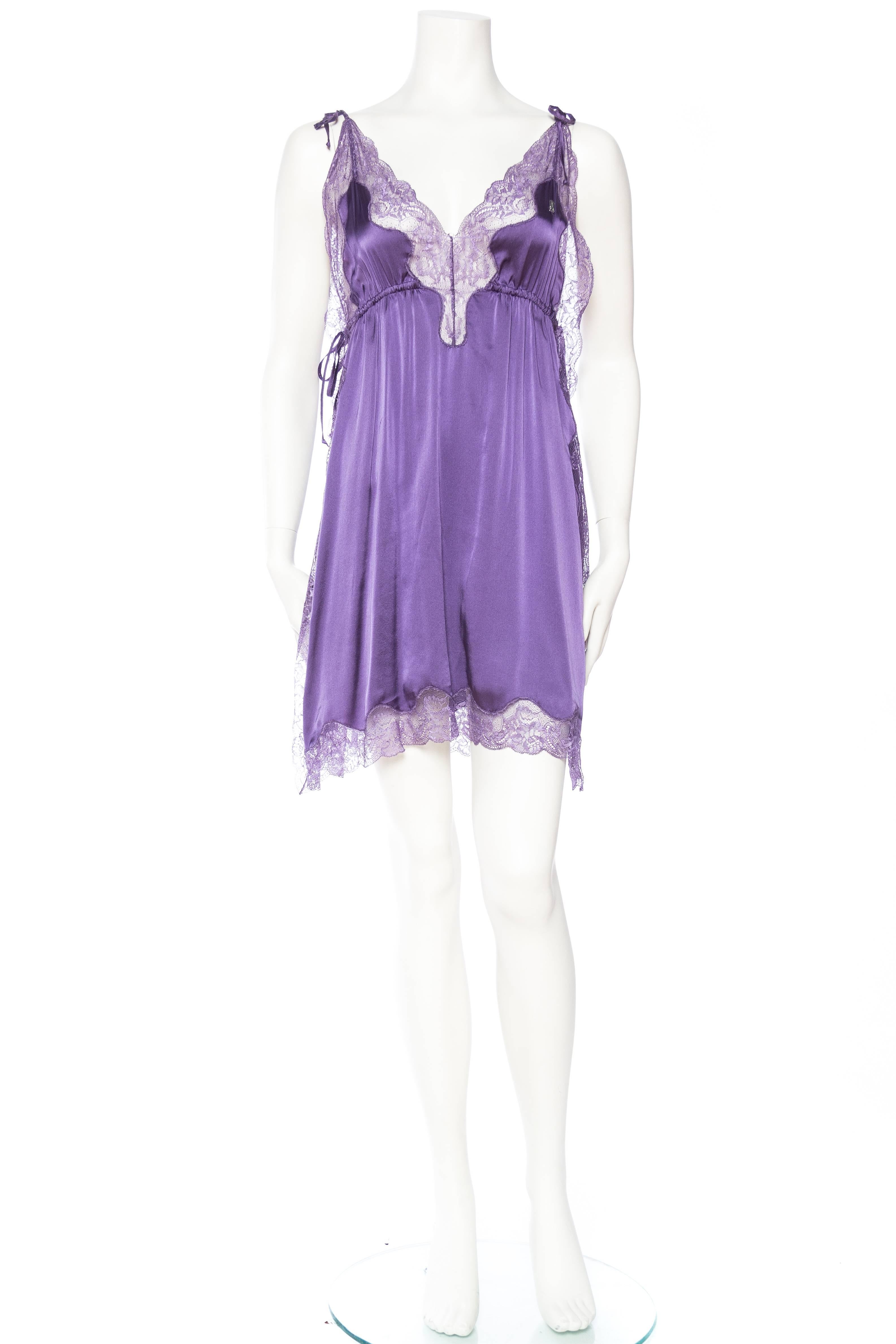 Much in the style of Chloe and Zimmermann this Galliano predates them all. A simple straight slip dress with a side zipper has two panels of satin trimmed in lace down each side. Adjustable ties at the shoulder and sides for a flirty vibe. 