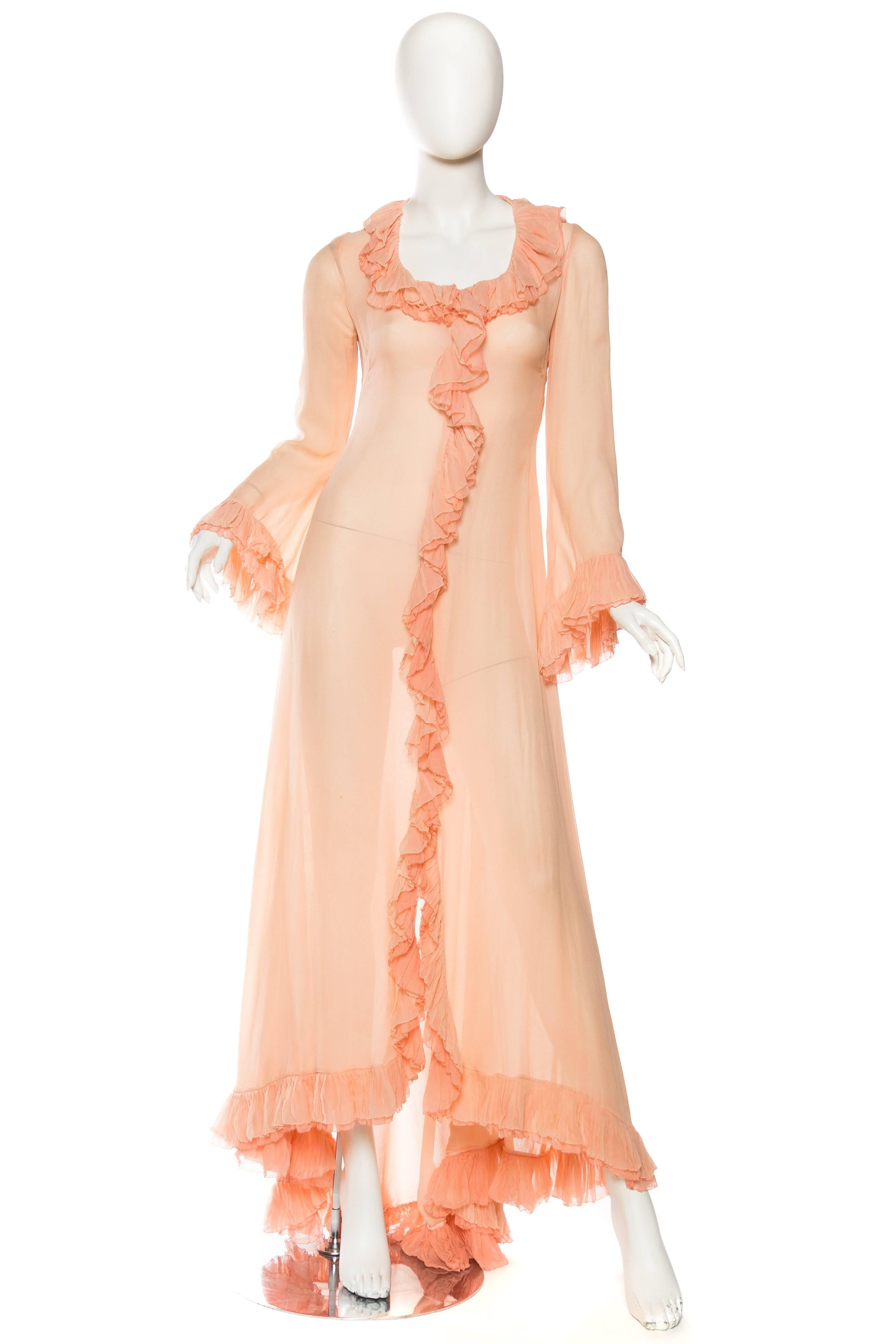 Negligee has a very soft and luxurious feel to the silk chiffon with a train and double ruffled cuffs. Can be worn as a dress also with a slip. 