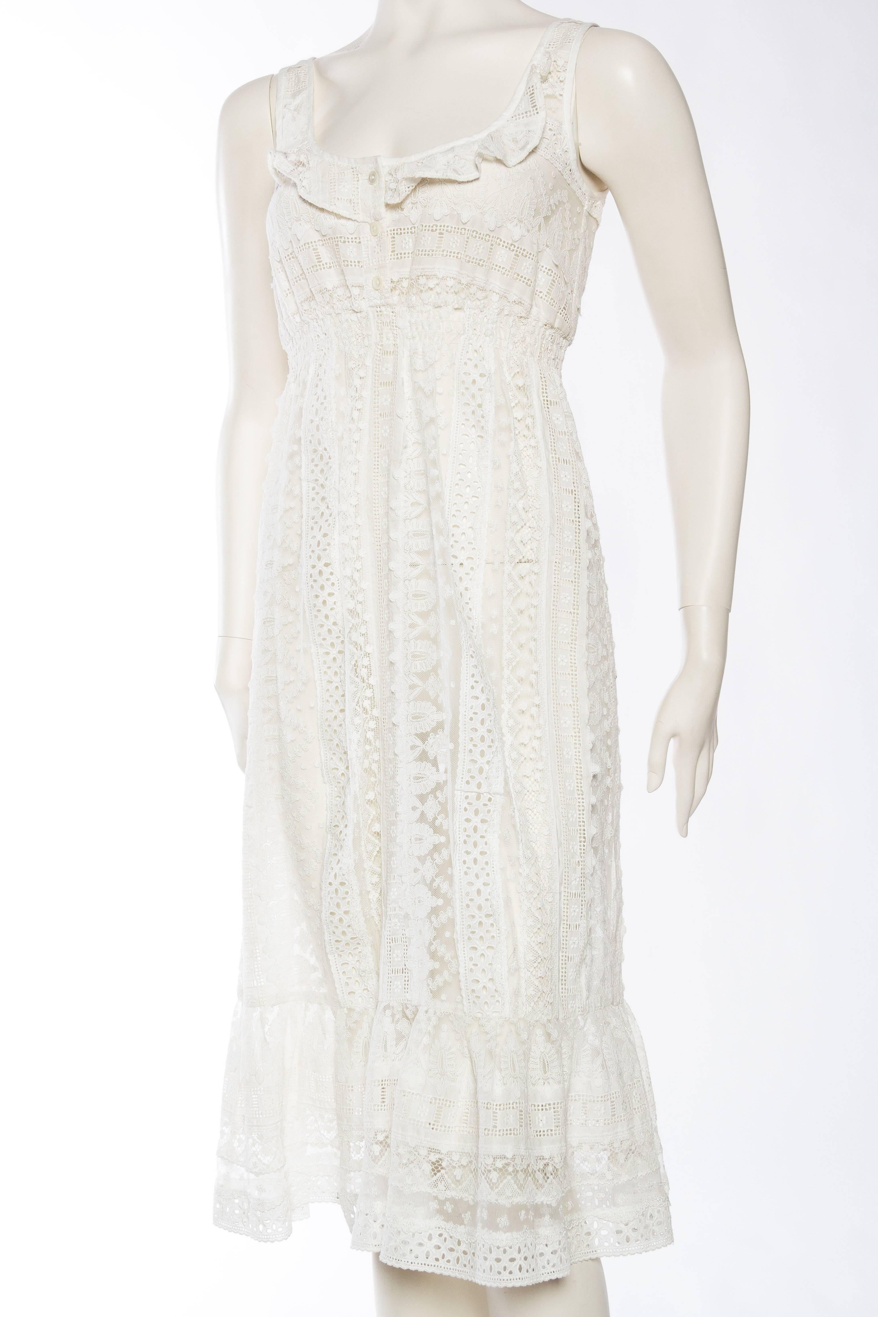 From the 1970s in an Edwardian or Victorian style this dress was purchased in Paris and appears to have been made there. Beautiful sheer cotton has been fully embroidered with a lovely eyelet pattern and pieced with net lace. The dress is finished