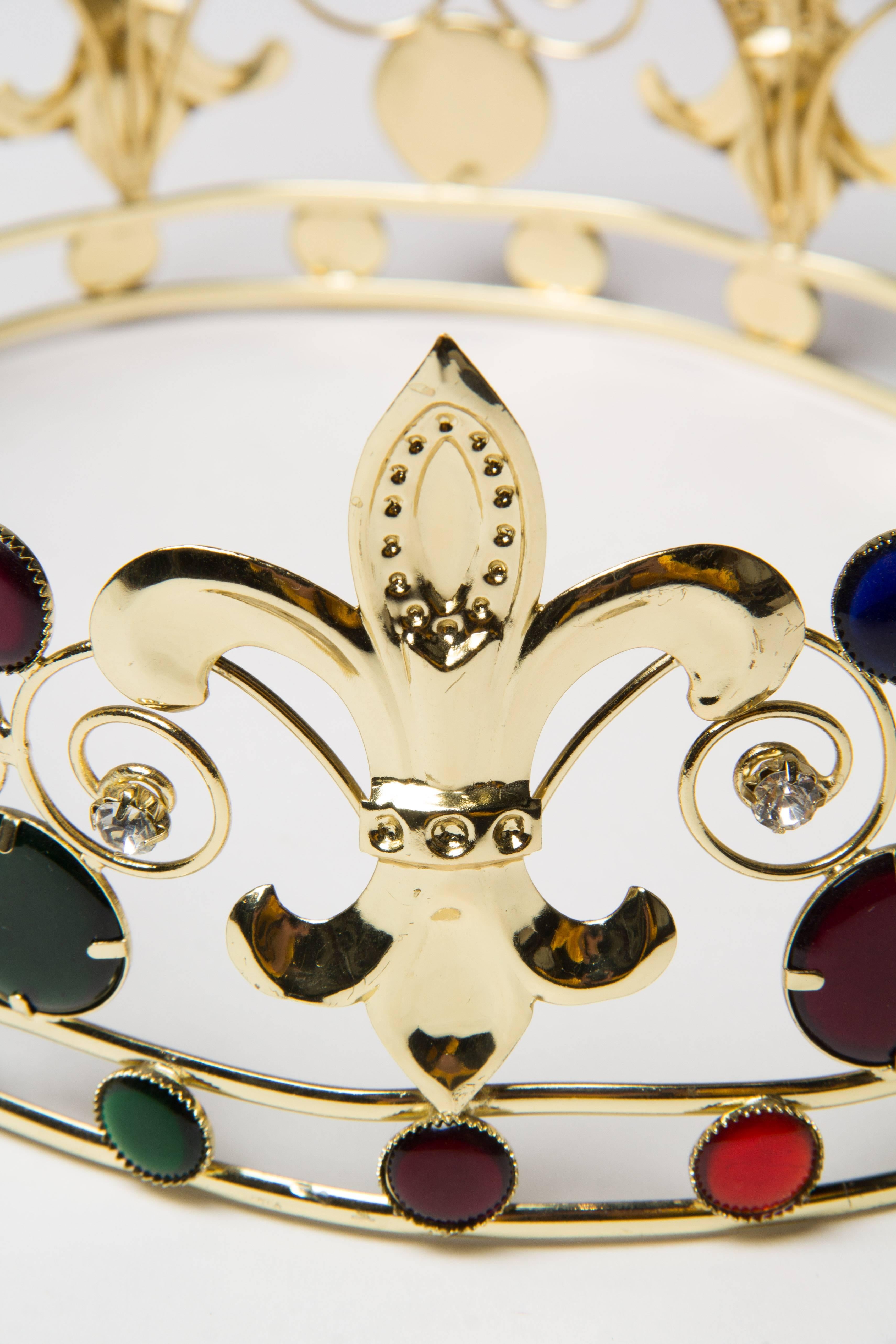 Gold metal cast and wrought in the 1970s set with crystal diamonds and faux jewels. Fits a size larger to medium-large head, approximately a size 7 1/2 Soft metal can be gently molded to custom fit your head. 