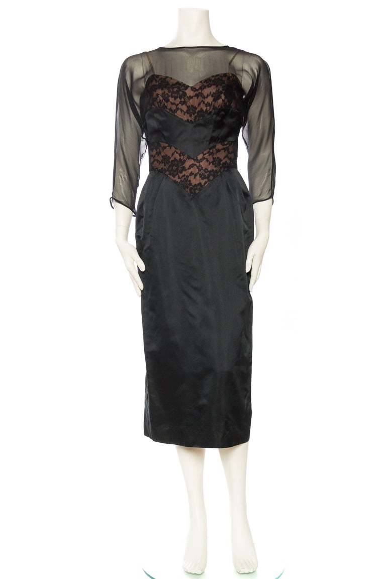 Silk satin and chiffon with lace built on a boned bodice of rayon, structured and ladylike.
