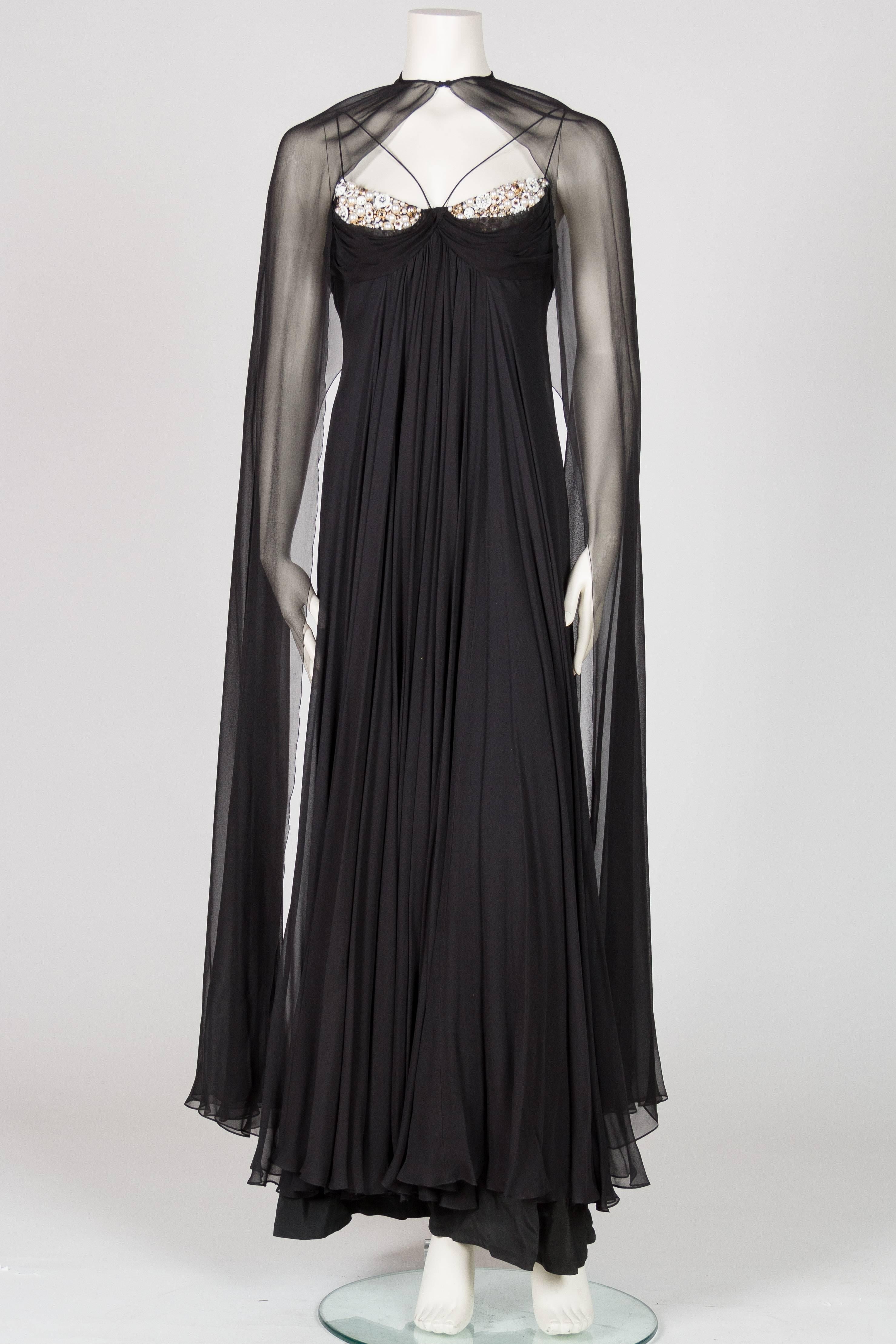 Empire waist with zipper up back, fits small to medium bust. Accented with pearls, beads and crystals. Lined in silk. Listing as 1970s however this gown could be from the late 1960s. Valentino introduced this cut in 1966 and these style gowns are