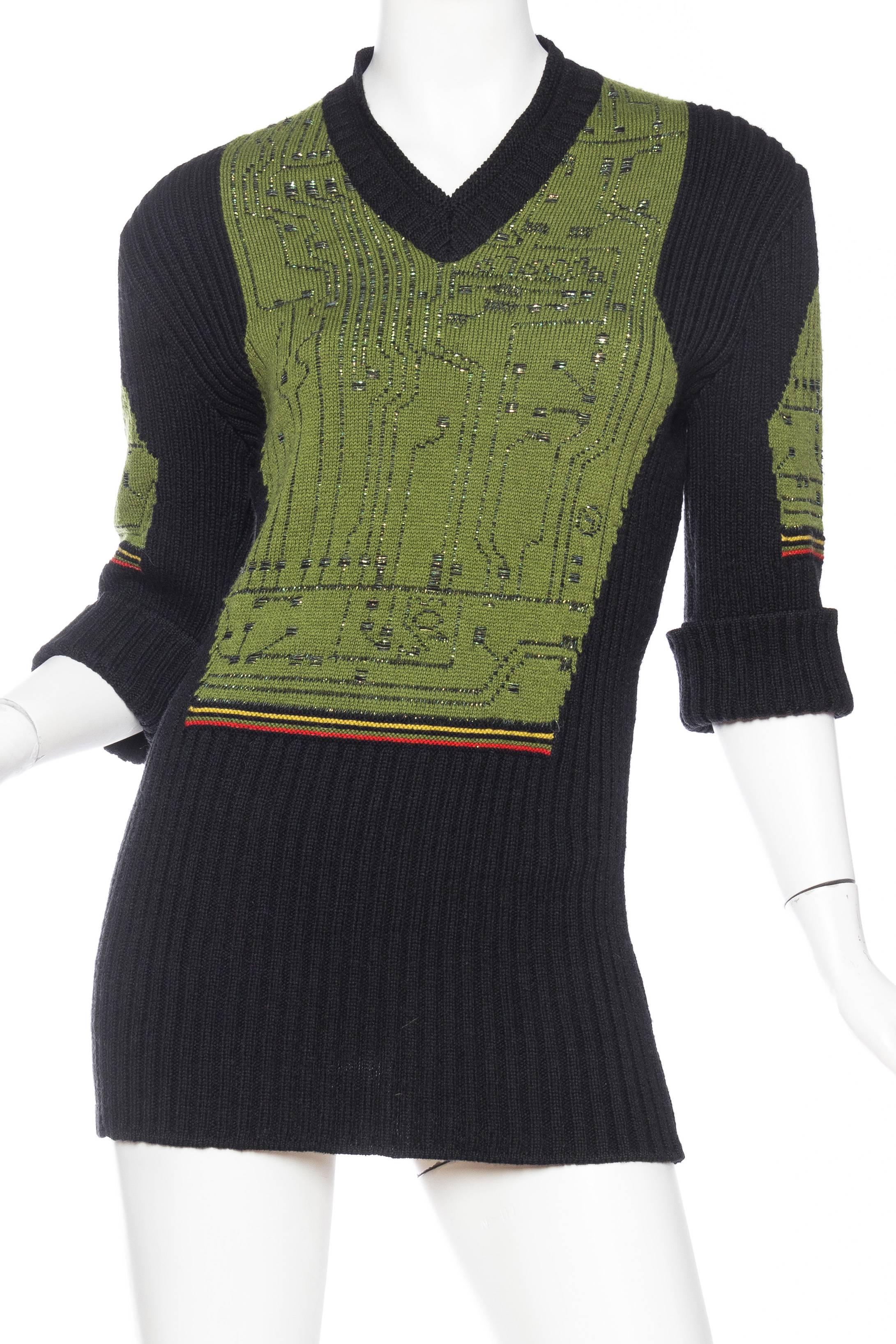 Very cool and very of the time when the world became tied to the computer and we never knew how much it would change. Jean Paul Gaultier tapped into this shift in our society and created this robot sweater knit with metallic threads to resemble the