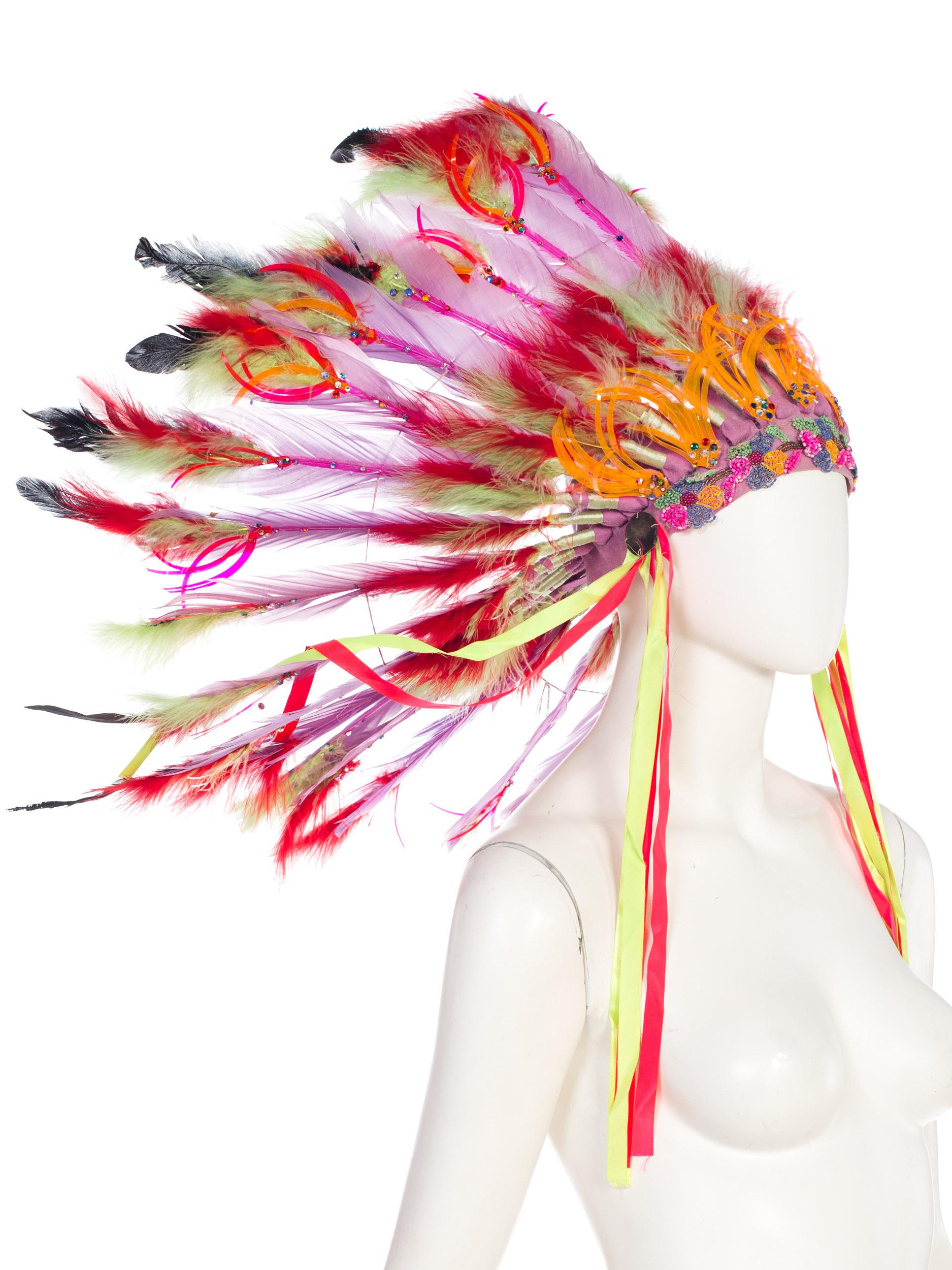 Fantastic neon colors in feathers and vinyl with antique 1920s bead trim and swarovski crystals. 