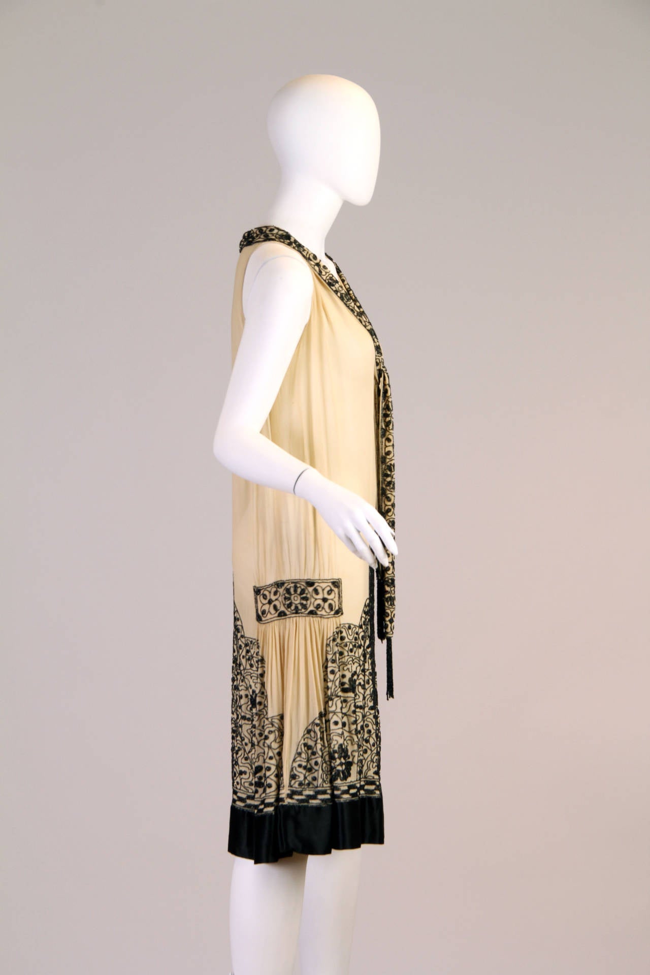 The finest silk and beads were used in the construction of this dress and this is why it has lasted this long. The silk is strong and very wearable. The Art Deco beadwork is done with faceted beads which glimmer that special bit more than standard