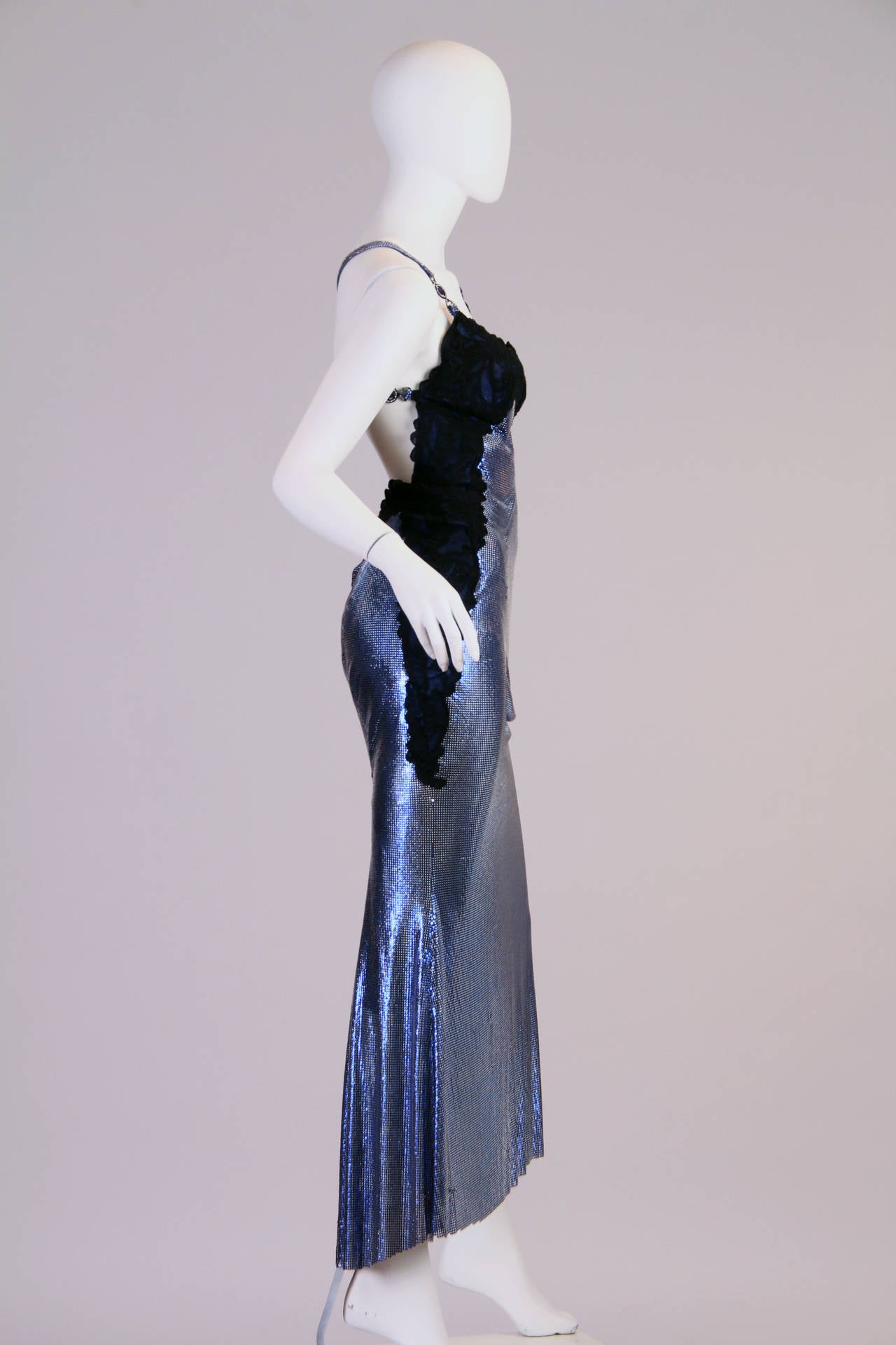 Not just a gorgeous gown but a strong statement from a designer who's career was just about to be cut short. Here Gianni Versace has referenced the neglige. He took the most private of garments of a woman's wardrobe, when a woman is at her most