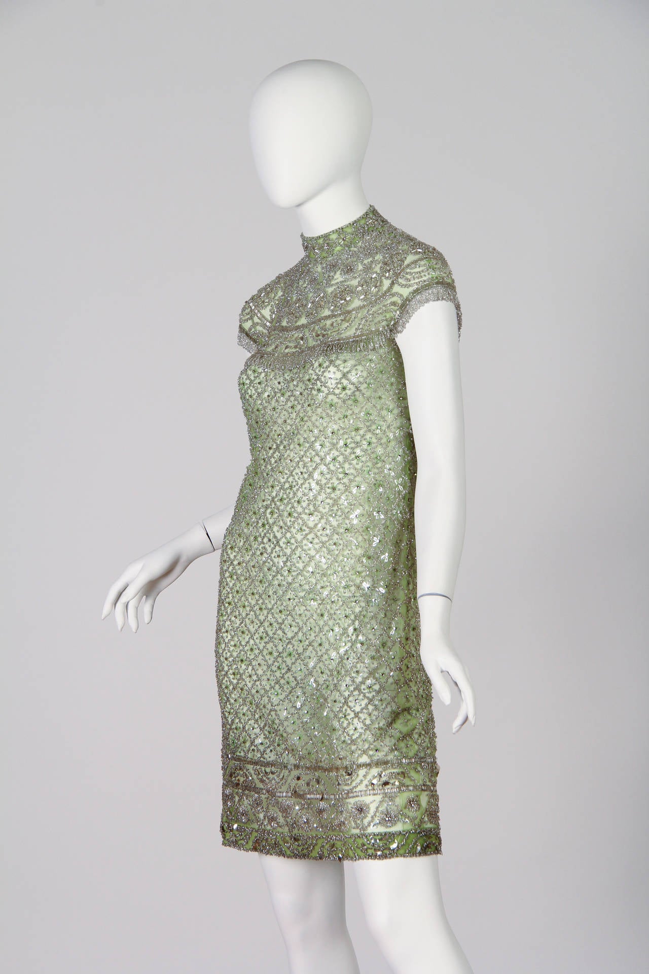 Phenomenal beads and crystals encrust this dress from the mid 1960s.