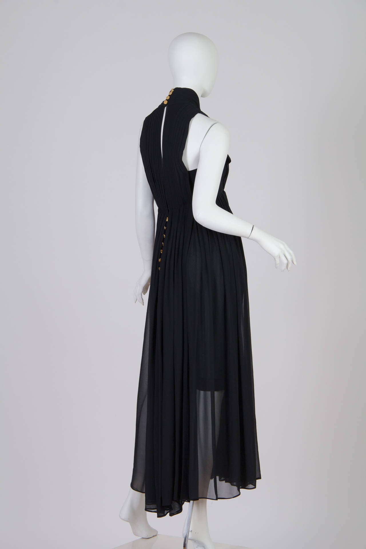 Very fine work on this gown from Chanel. The label reads boutique but this vintage quality gown is made better than the boutique clothing they make today. There are two internal waist stays to ensure that the dress stays put and numerous gold Chanel