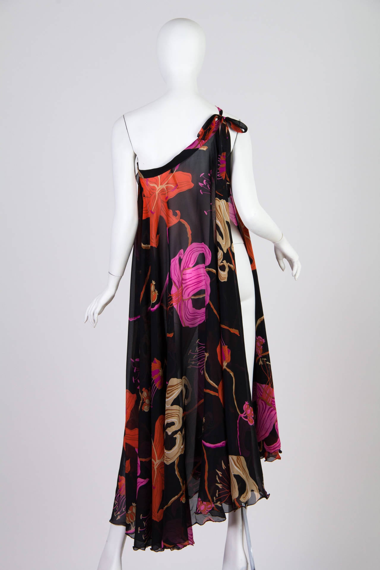 A beautiful and versatile piece from the fabulous 1970s. This piece is made from the finest Italian silk which is woven so fine yet so tight it maintains it's floaty weight yet resists wrinkling. Designed to be worn both as a skirt and as a dress.