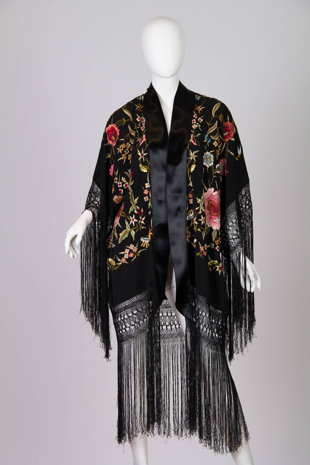 We made this ensemble from a beautiful hand embroidered piano shawl. The shawl dates from the 1910s to the 1940s however they were most produced and imported to the United States in the 1920s. It was common practice in the day to make boudoir
