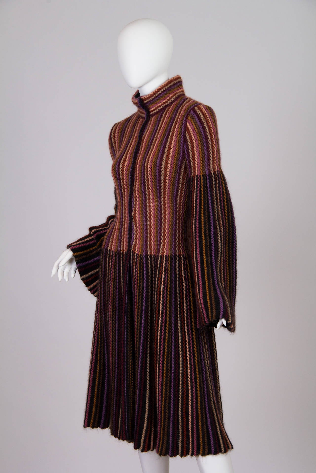 Chic, cozy and timeless. This piece has an older orange label and is from the 1990s. The style however is very 1970s boho, or late 1920s even with the long bell sleeves. Beautiful colours and wonderfully soft you will want to live in this piece.