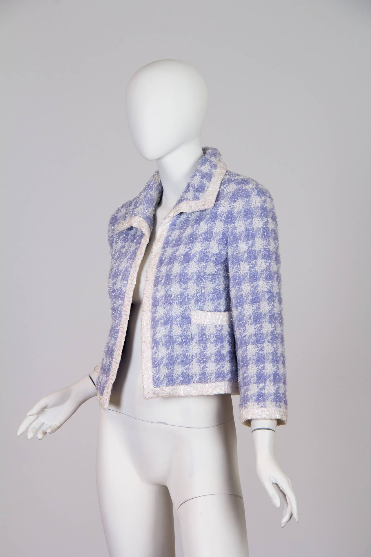 From the 1990s or possibly later we have this rare spunky Chanel Jacket. From a house known for its classics we live how they've taken this jacket out of the norm with the lured in the weave and the fun yet still pretty colour. In near mint