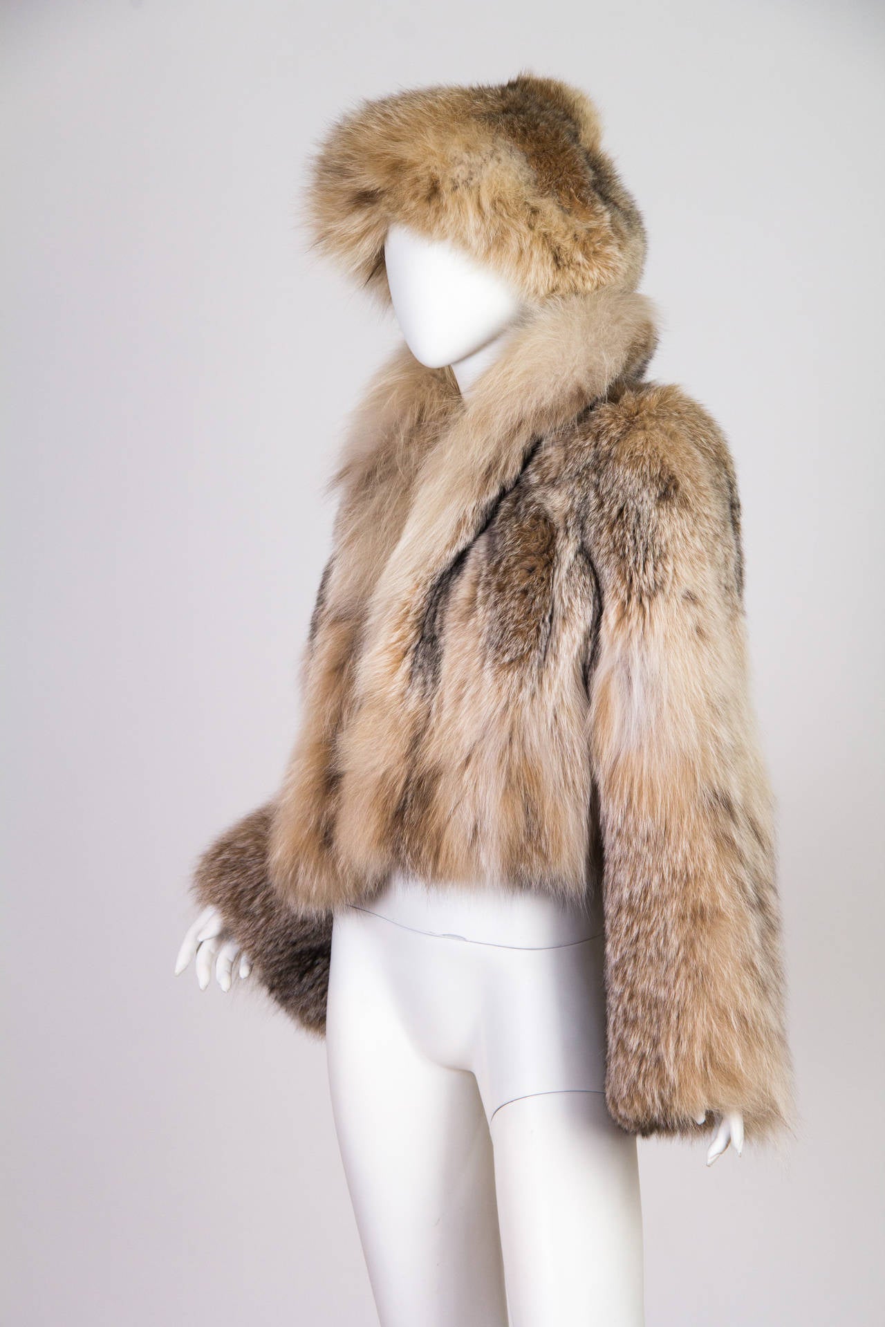This is a beautiful fur jacket and hat set by Adolfo II for Saks Fifth Avenue. The full collar on the jacket takes full advantage of the wonderfully plush cream and ruddy brown fur, and the symmetry in the placement of the fur patterns shows the