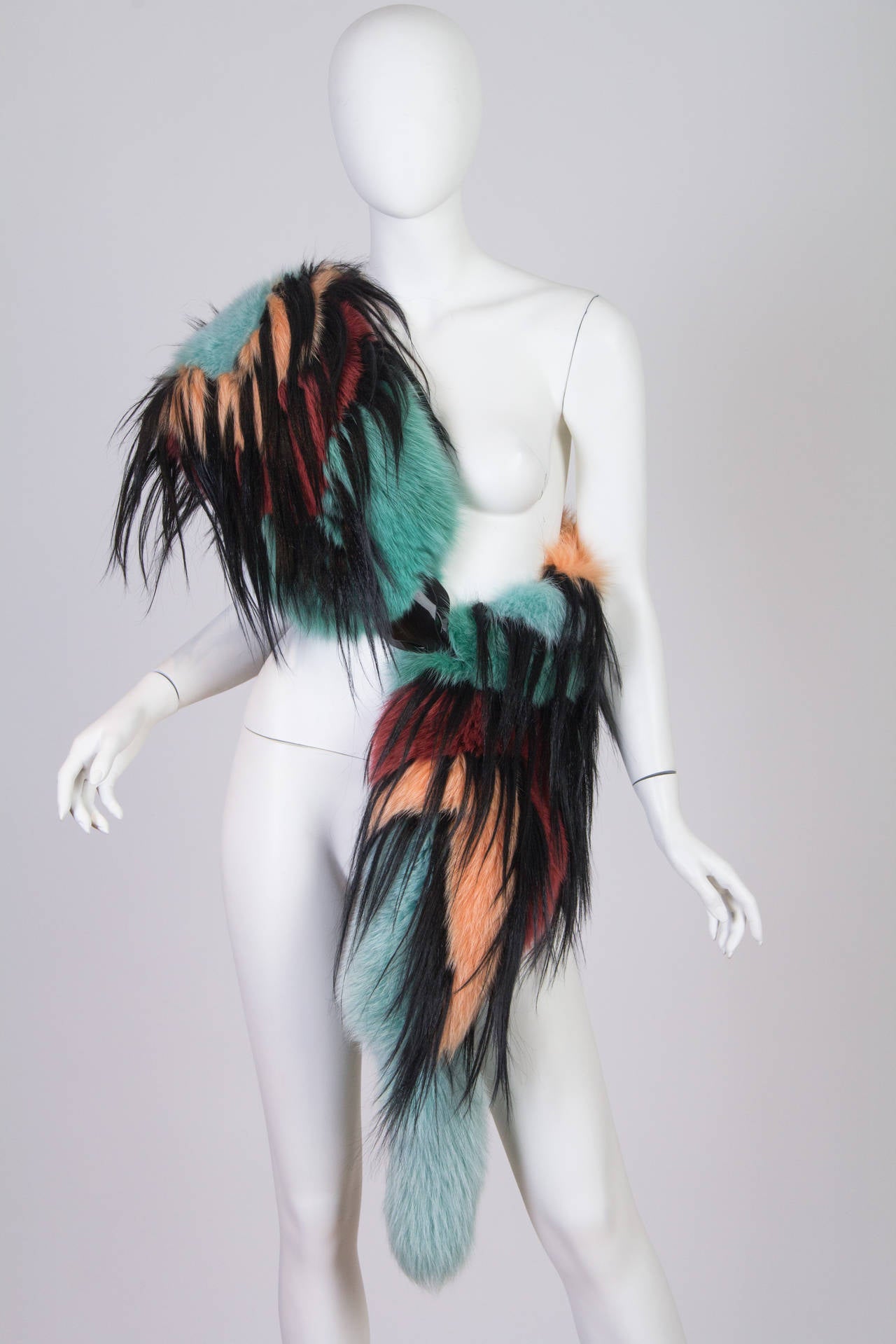 This is a striking and playful fur stole by top design house Missoni. The multicoloured and multi-textured garment is made to mimic the form of a classic fox stole – complete with a tail and ‘beak’ – but with the bright colours and zig-zag patterns