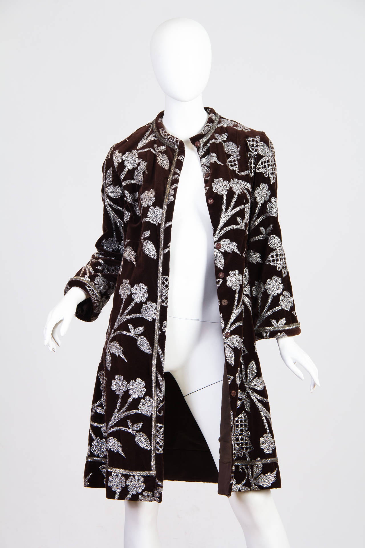 Bill Blass, one of America's premier designers, got his start designing private label for retailer Maurice Rentner in the 1960s. This coat shows Bill Blass's cool clean understanding of line and shape as well as his taste for luxurious detailing and