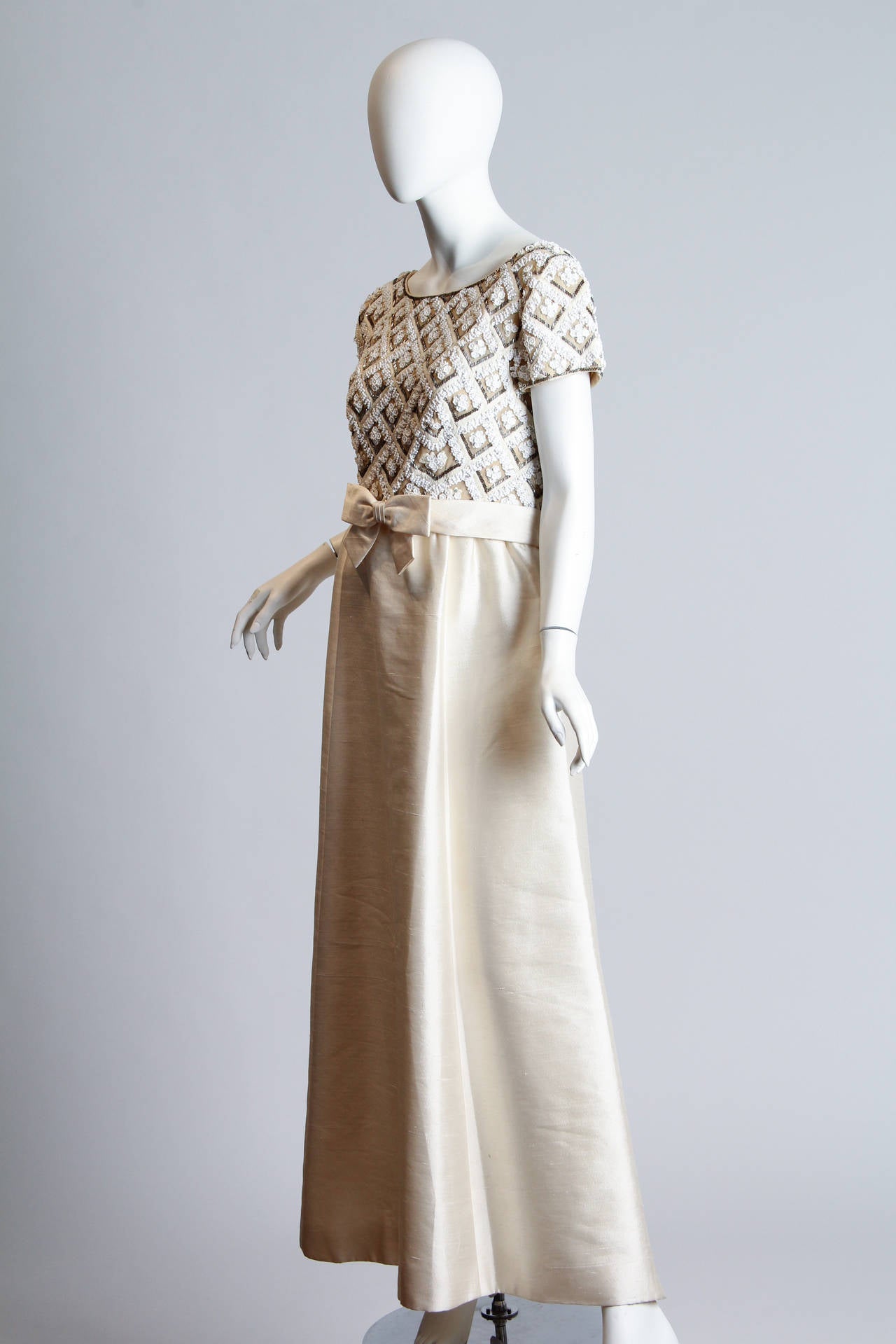 1960S Ivory Beaded Silk Radzimir Cap Sleeve Couture Detailed Gown With Slight Empire Waistline & Waist Bow