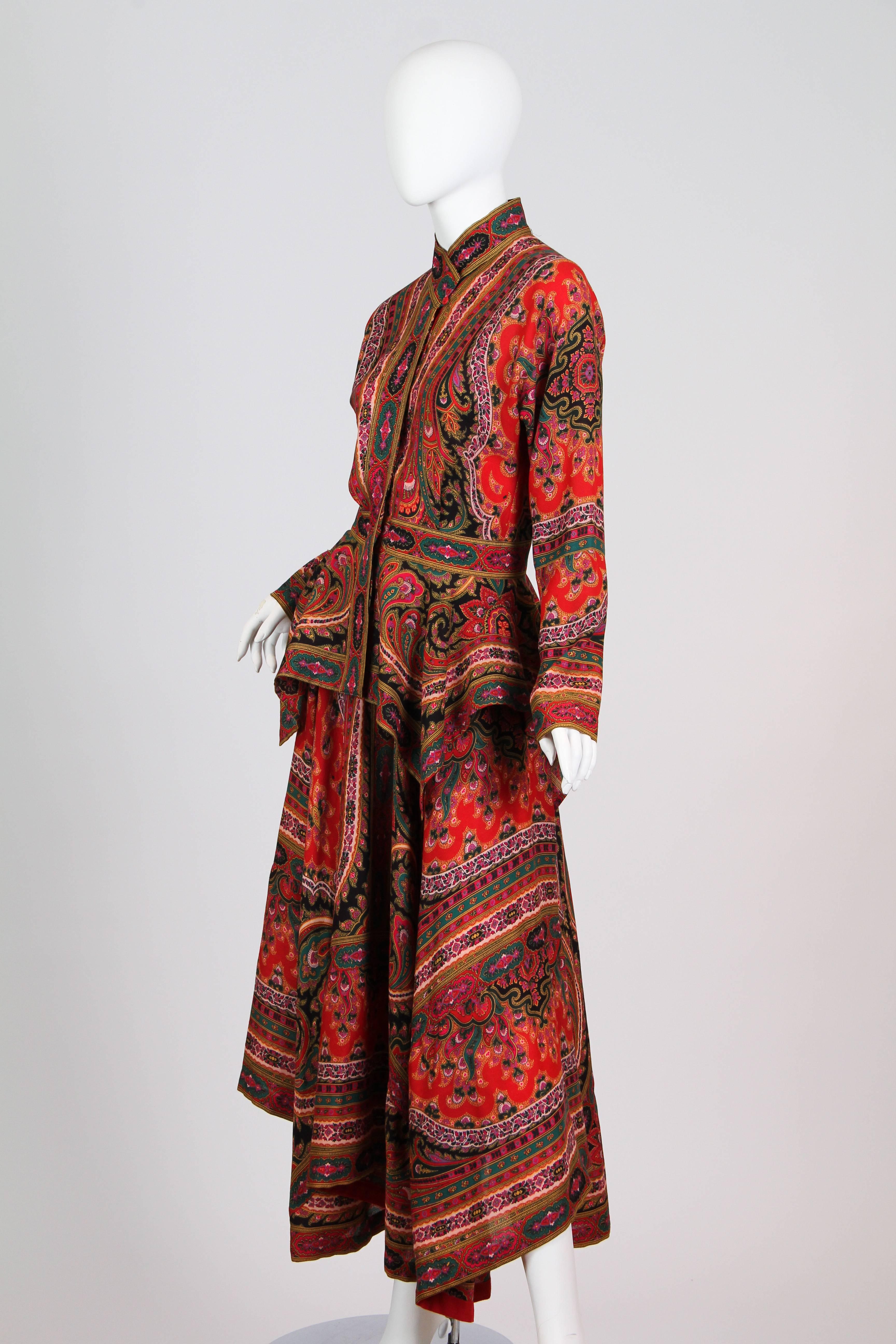 This is a wonderful jacket and skirt suit by Kenzo Paris. Made of a richly colored and complexly patterned wool twill print, it is reminiscent of the beautiful paisley wrapping gowns of the late Victorian period, which were made out of sumptuous