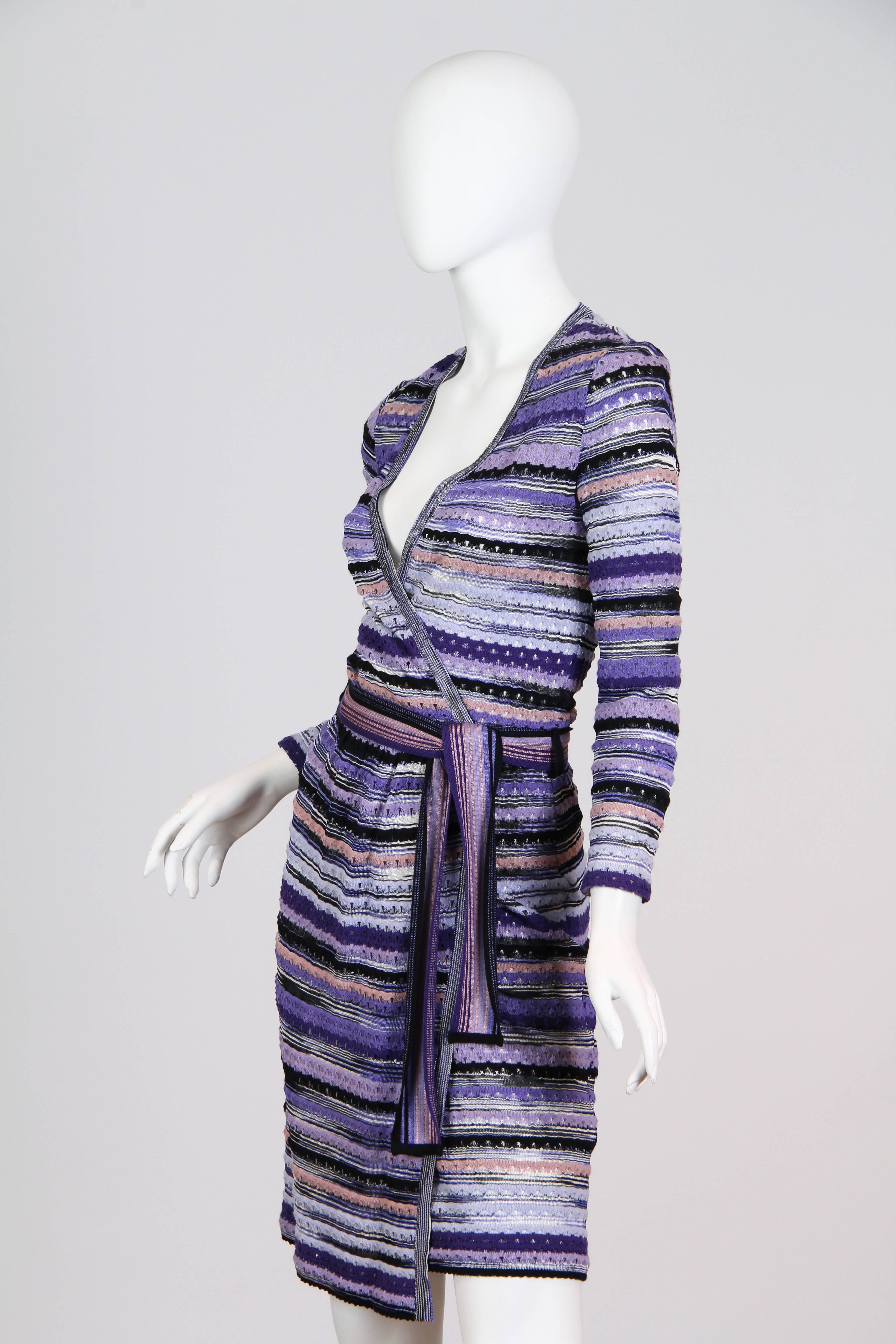 This beautiful mid weight wool blend wrap dress from the esteemed house of Missoni will surely become your fall favorite. Dress comes with co-ordinating sash belt and is semi-sheer.