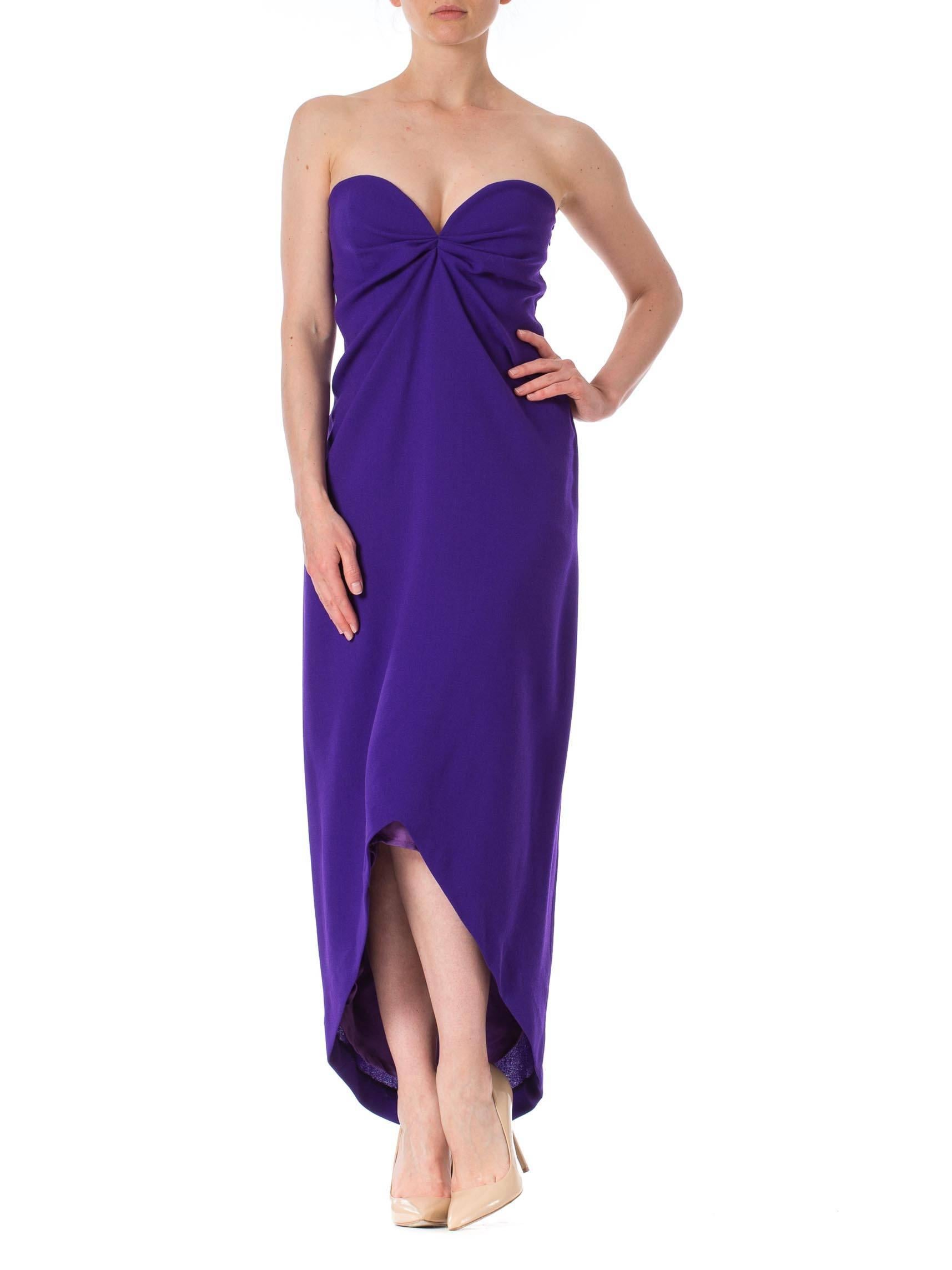 Gorgeous crepe dress built with an inner bodice and waist stay to keep the dress in place. This is a boldly hued strapless dress from Yves Saint Laurent's 'Variation' line. Made in 100% virgin wool, it is a striking shade of royal purple. The
