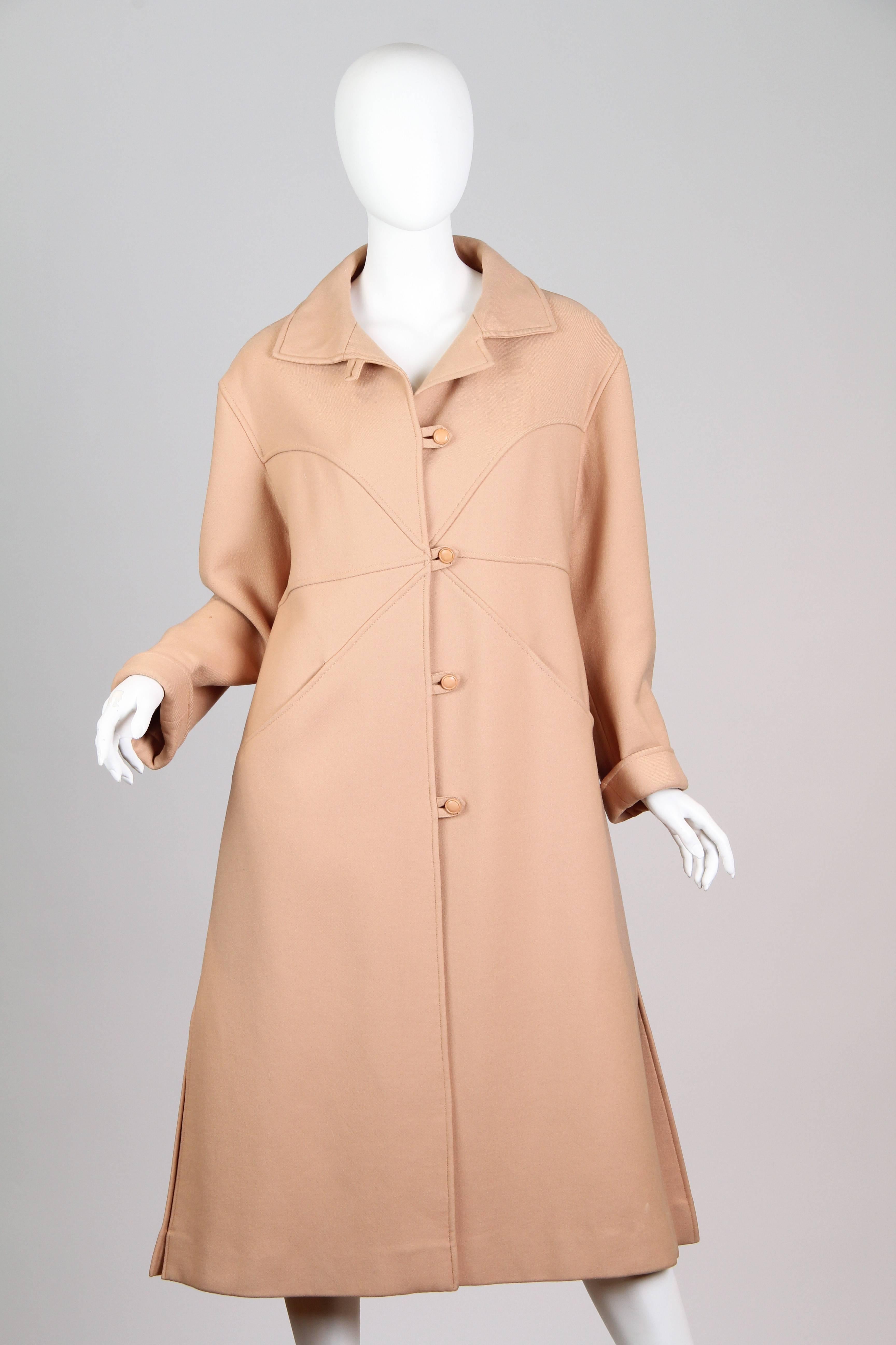 Gorgeous wool coat from Courréges  with great Mod styling and seaming details. Dating from the 1960s or early 1970s. 