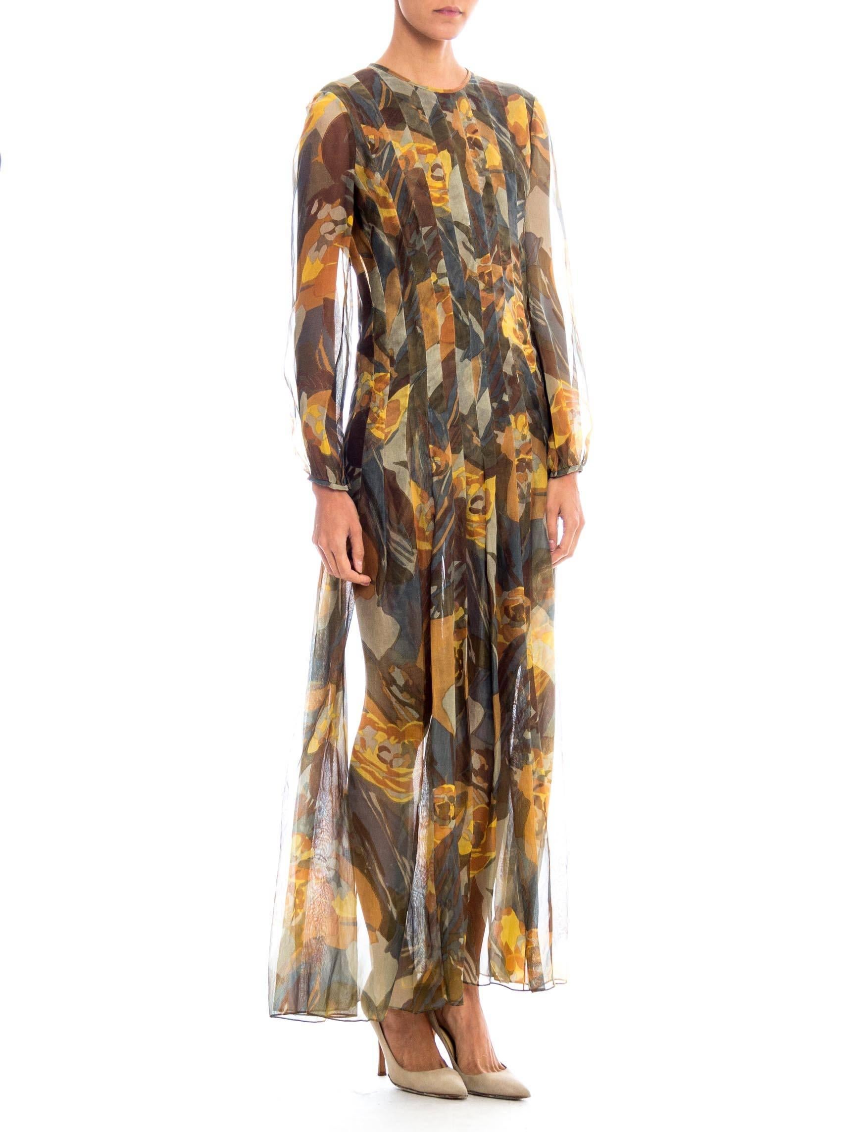 We believe this beautiful dress from Pauline Trigere has had the lining removed and may have been altered. Regardless it is a gorgeous dress in an abstracted floral print rendered in earth tones. The dress is cut wide but then has been pleated down