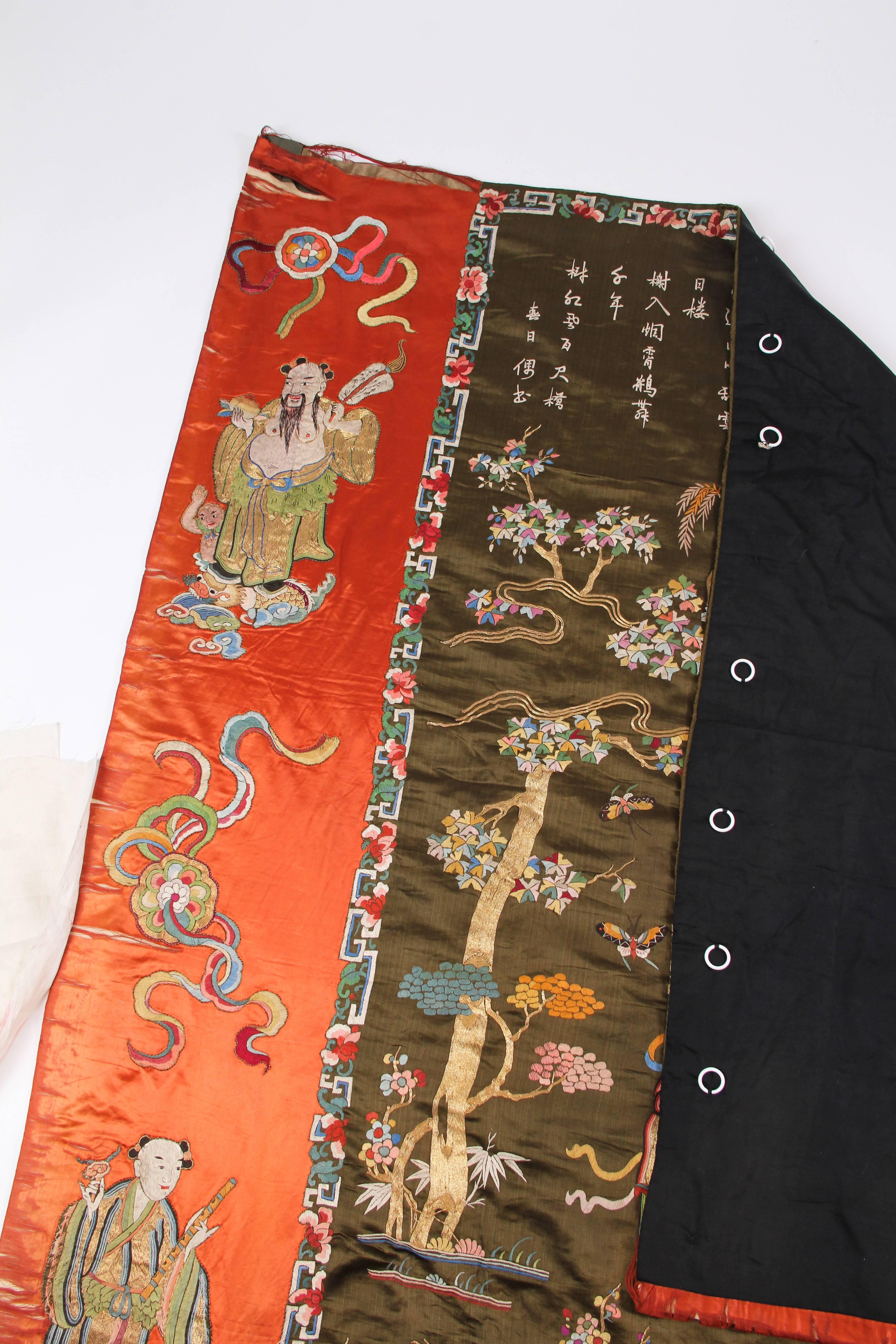 This is an incredible wall hanging made of embroidered silk satin. An antique piece from China, the traditional motifs show a rural scene picked out in perfect detail in polychrome silks. The hand embroidery is immaculate and shows a high level of