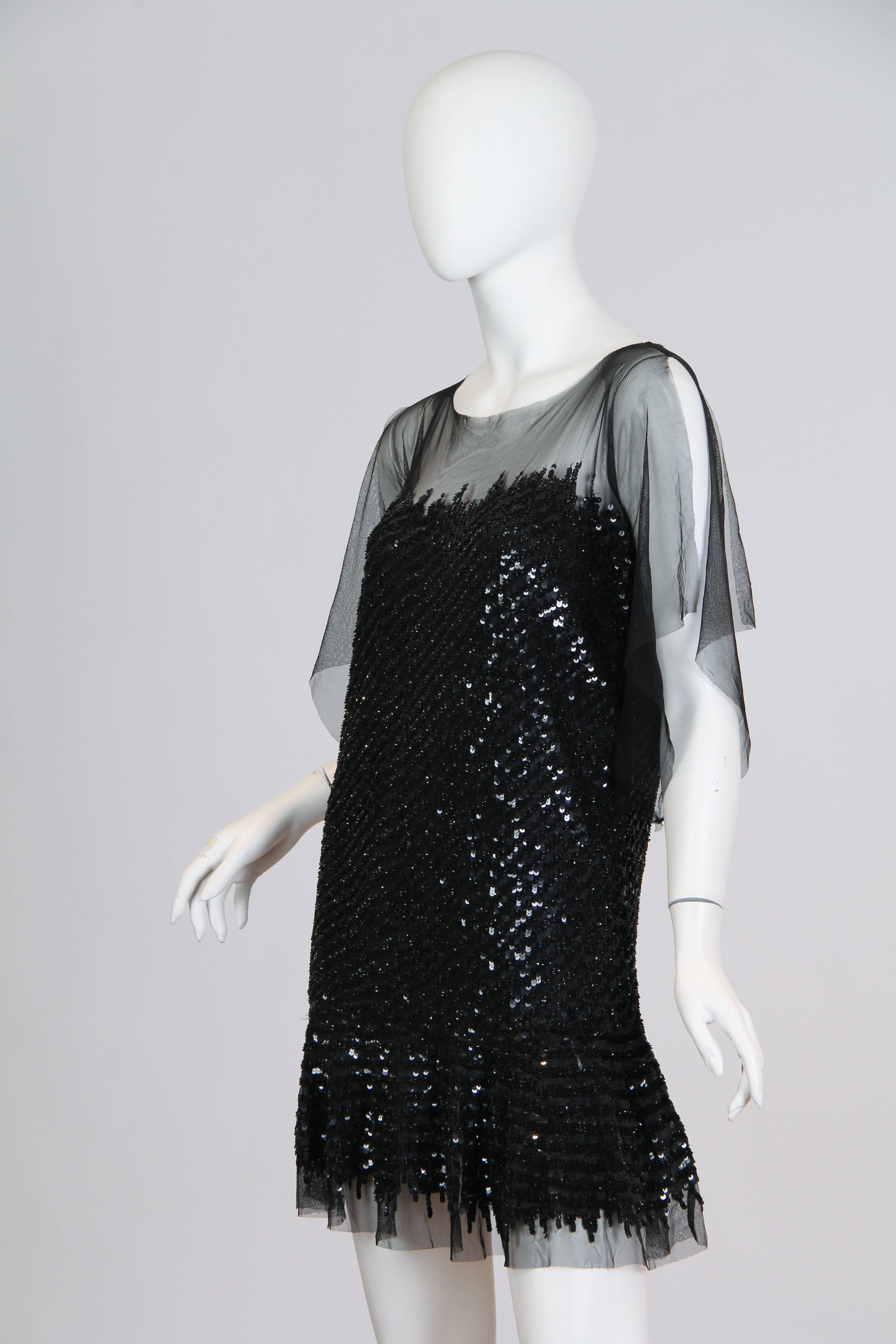 Fun and flirty the house of Cavalli clearly channels the roaring '20s with this short little frock. Cut straight and loose, meant to fall away from the body the short hemline is meant for dancing. 