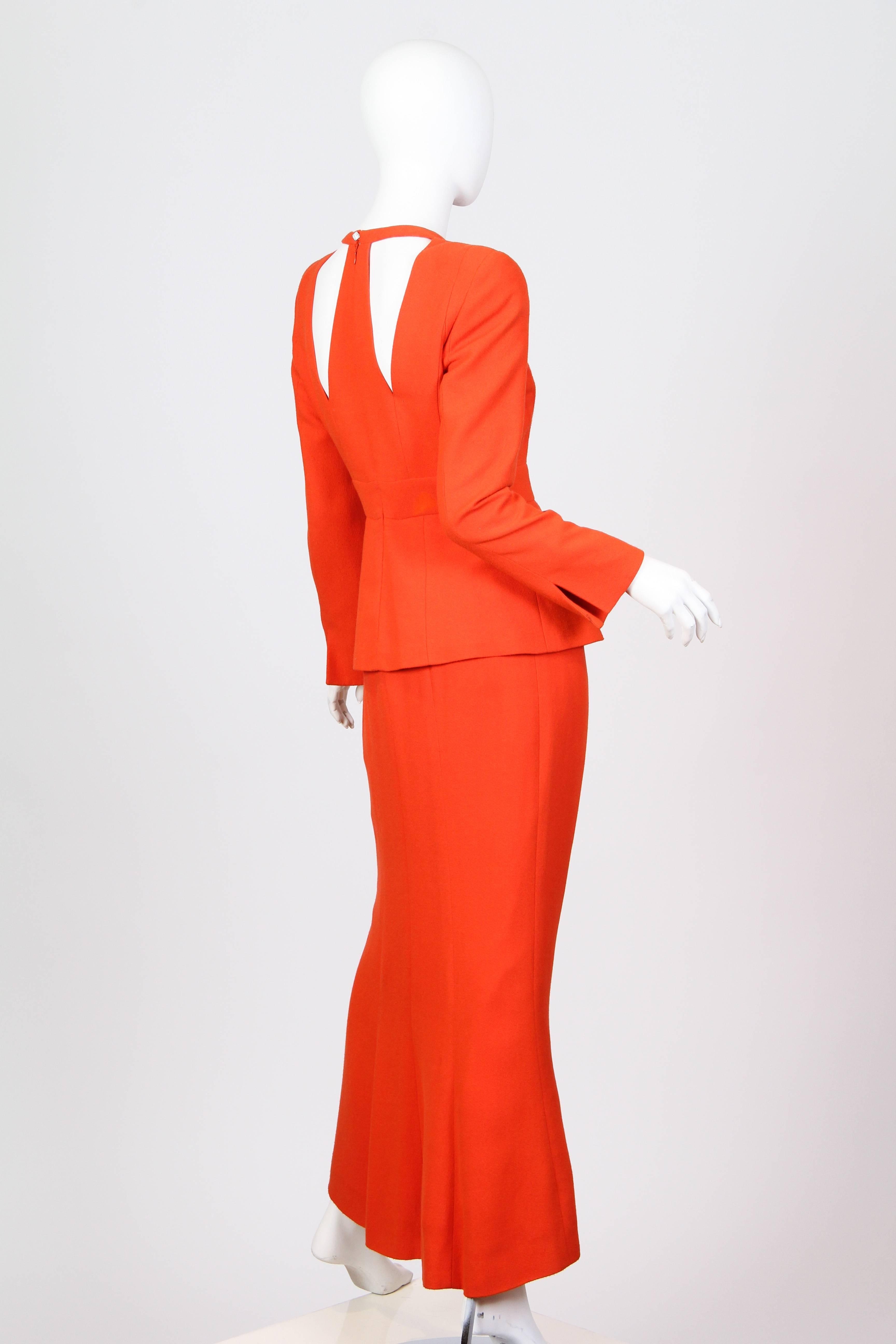 Structure and line define this dress in the smartest shade of orange. Bringing his couture knowledge of cut and construction to Chloé Karl Lagerfeld paints a strong woman in contrast to the flirty and soft image known for the house. 