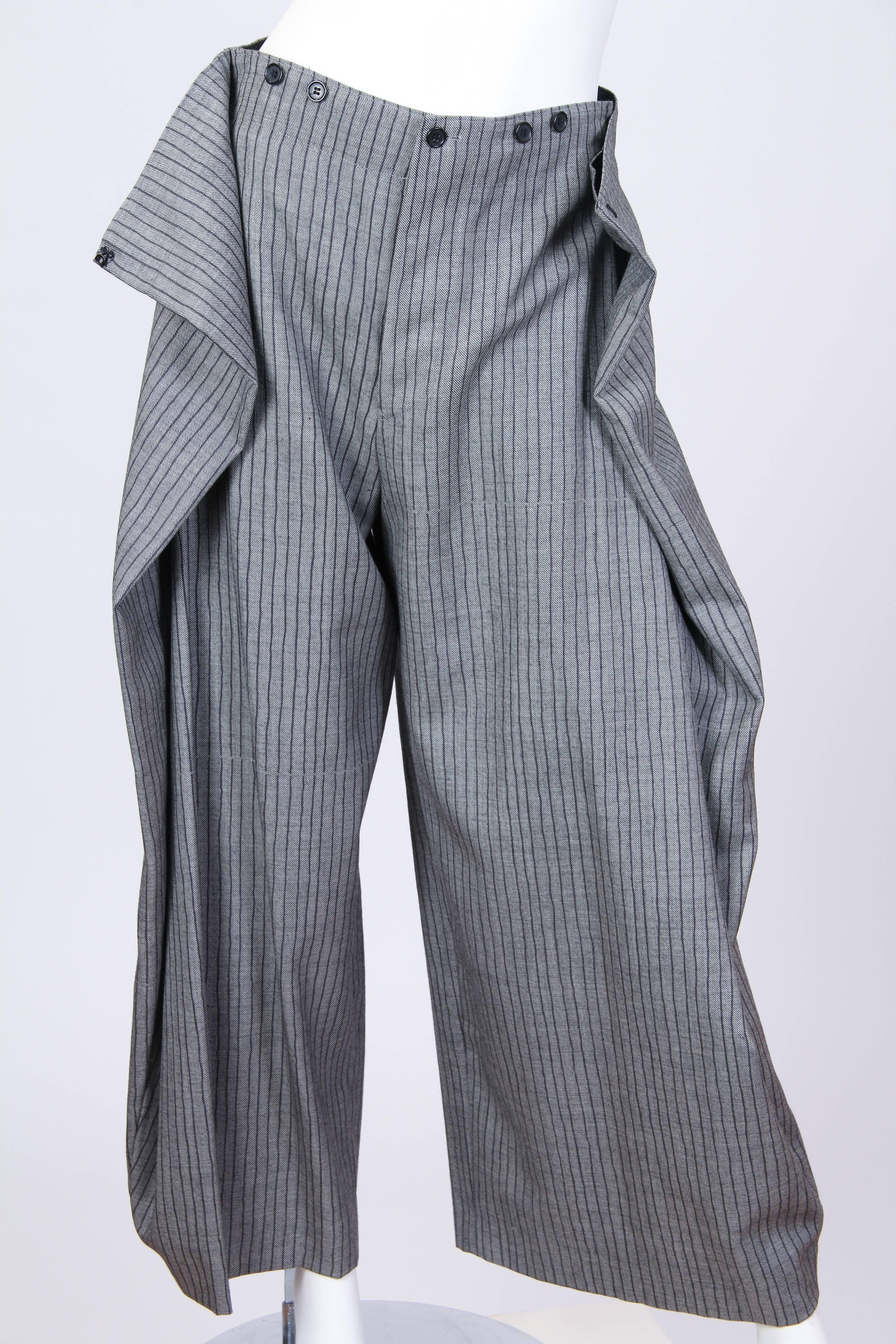 Ingeniously pleated and folded trousers from Jean Paul Gaultier. Victorian styling with the belt back and suspender buttons. 