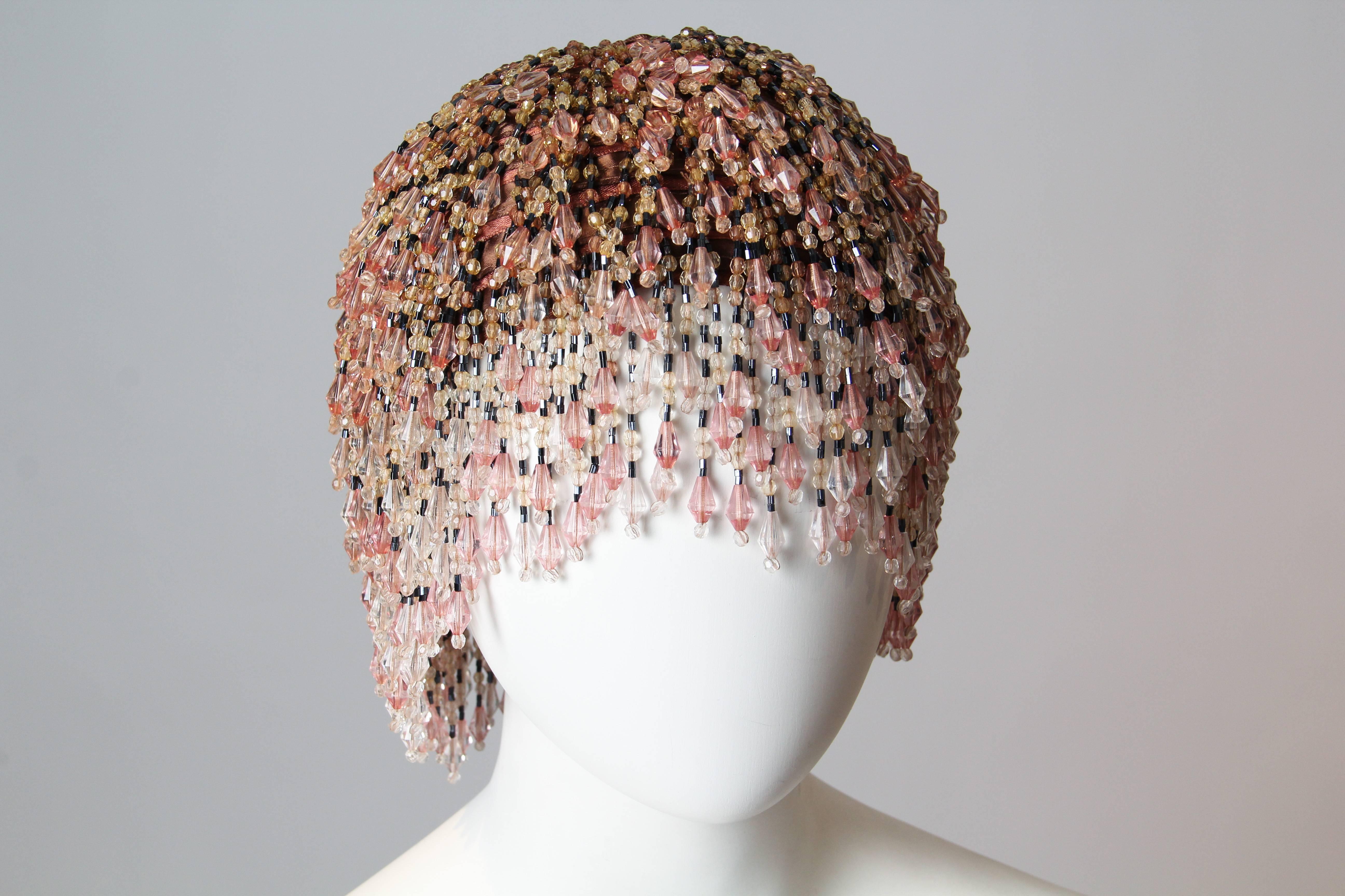 This is an incredible beaded headdress, inspired by the flapper headdress from the 1920s. The Jazz Age was a time of never-before-seen freedom and exuberance for women especially, as the post-war economy boom and the widespread scofflaw glee of