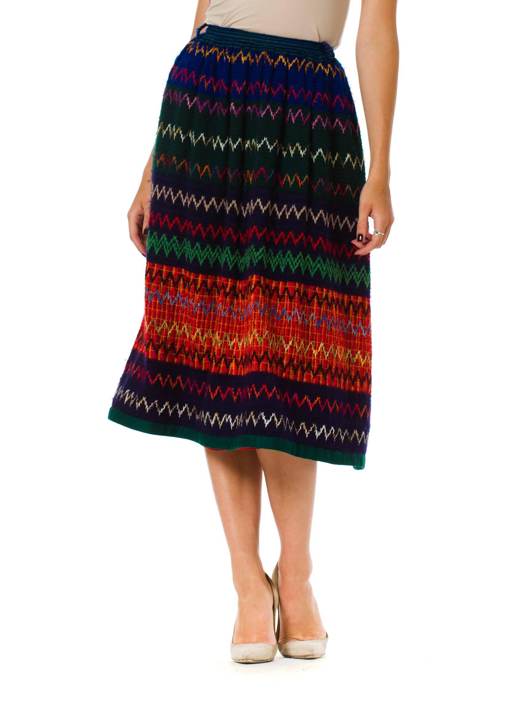 This wool skirt from Lanvin is the most beautiful weave. Many warm and cool colours combine to paint a picture of rich tones. The hem of the skirt has been wrapped with felt and stitched by hand, the silky lining has a similarly felt wrapped hem