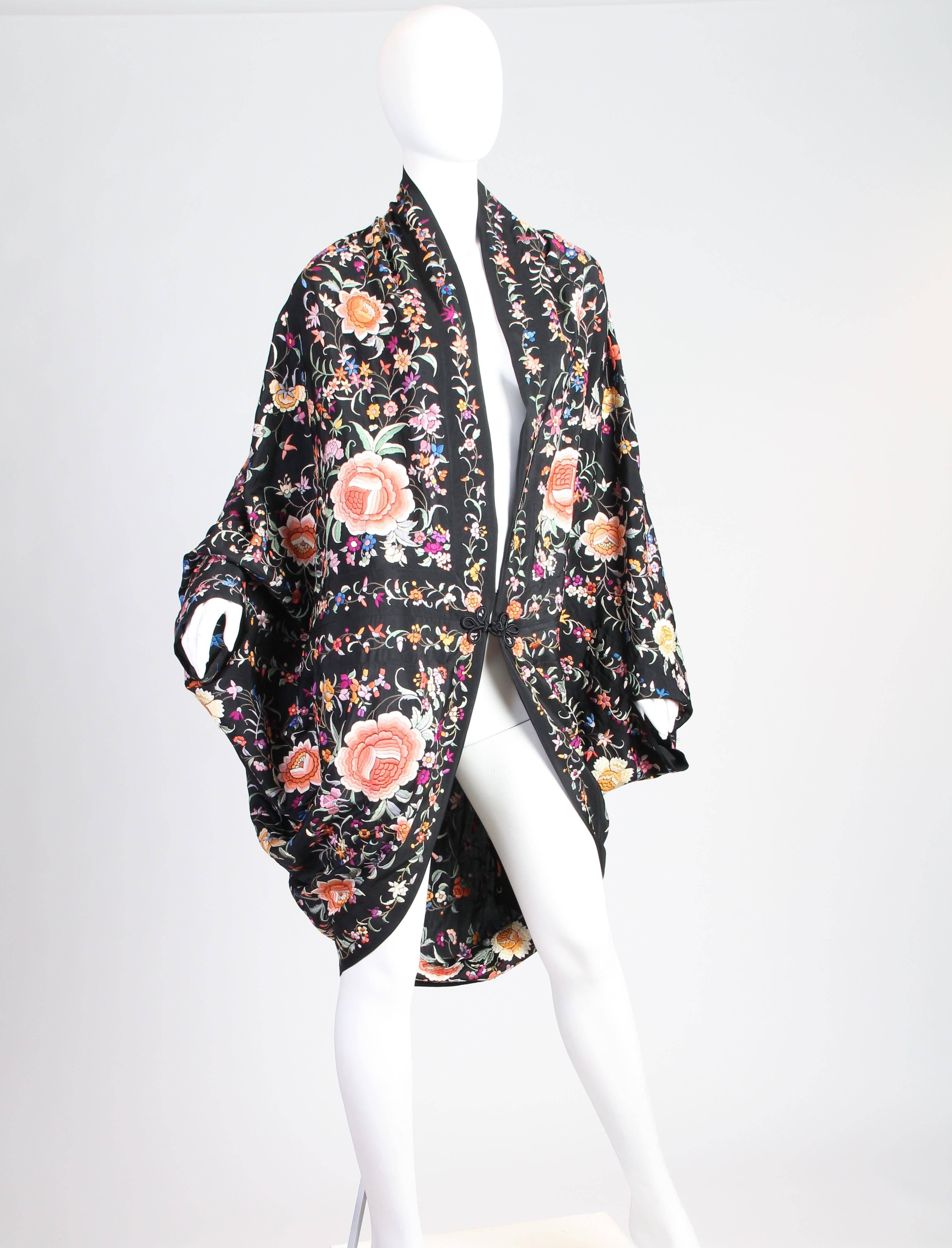 This is a stunning cocoon coat, made of a re-sewn shawl and most likely dating from the late 1910s or early 1920s. In the early 1910s, Poiret began designing coccoon coats to accent the new fashions of the day, which were becoming slimmer and more