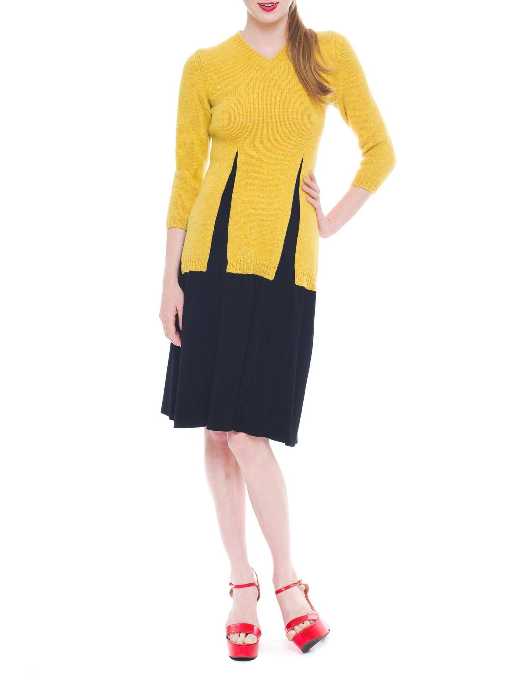 This is a cool dress in black and yellow, designed to look like a sweater over a skirt. The upper section is a textured sweater stockinette in a soft but sunny yellow, while the skirt is made of a finer black knit. The sweater portion has been knit