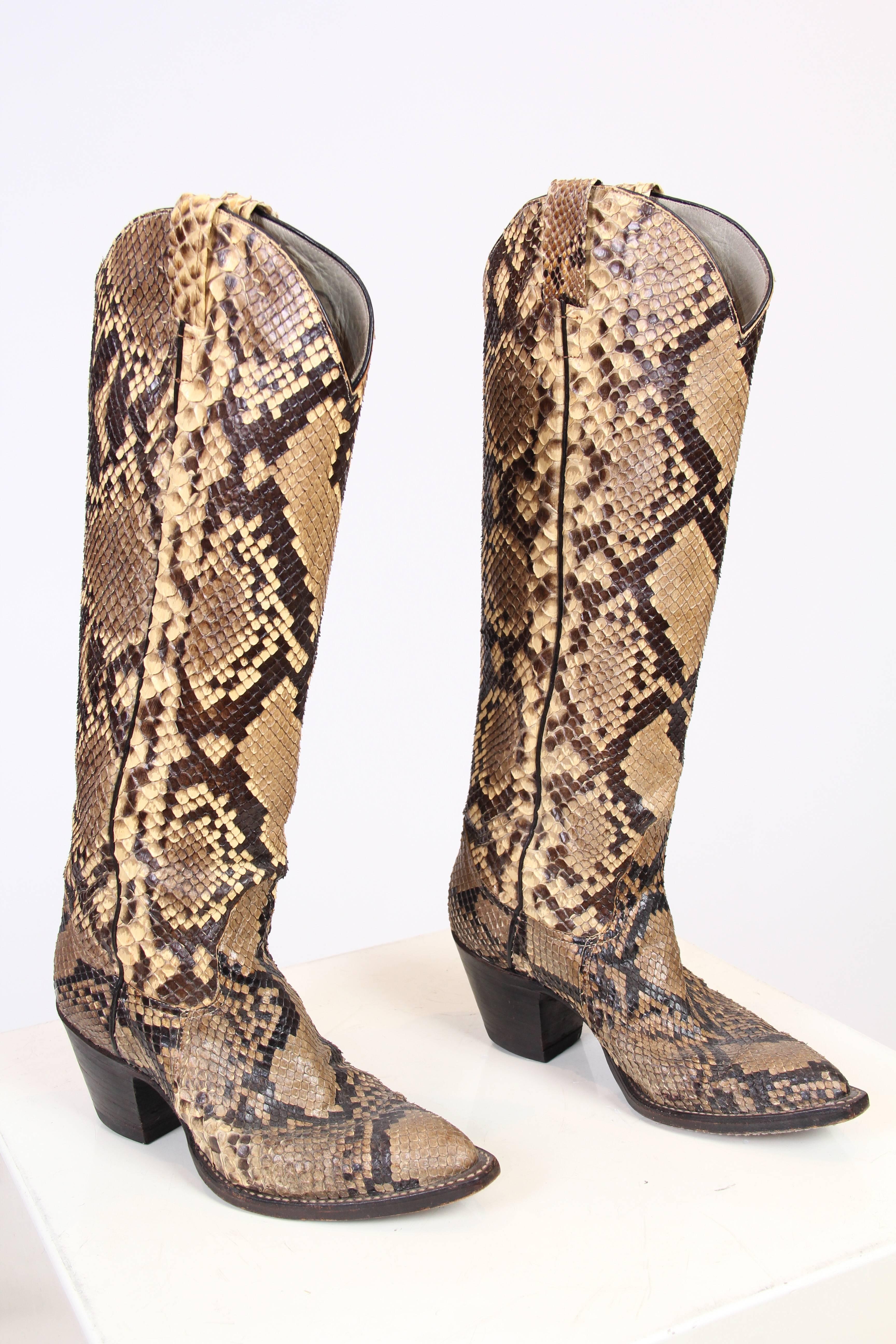 This is a pair of classic snakeskin cowboy boots in classic shades of tan and chocolate brown. In these boots, the ultimate symbol of the American West is mixed with the glamour of exotic materials and natural patterns to create a striking visual