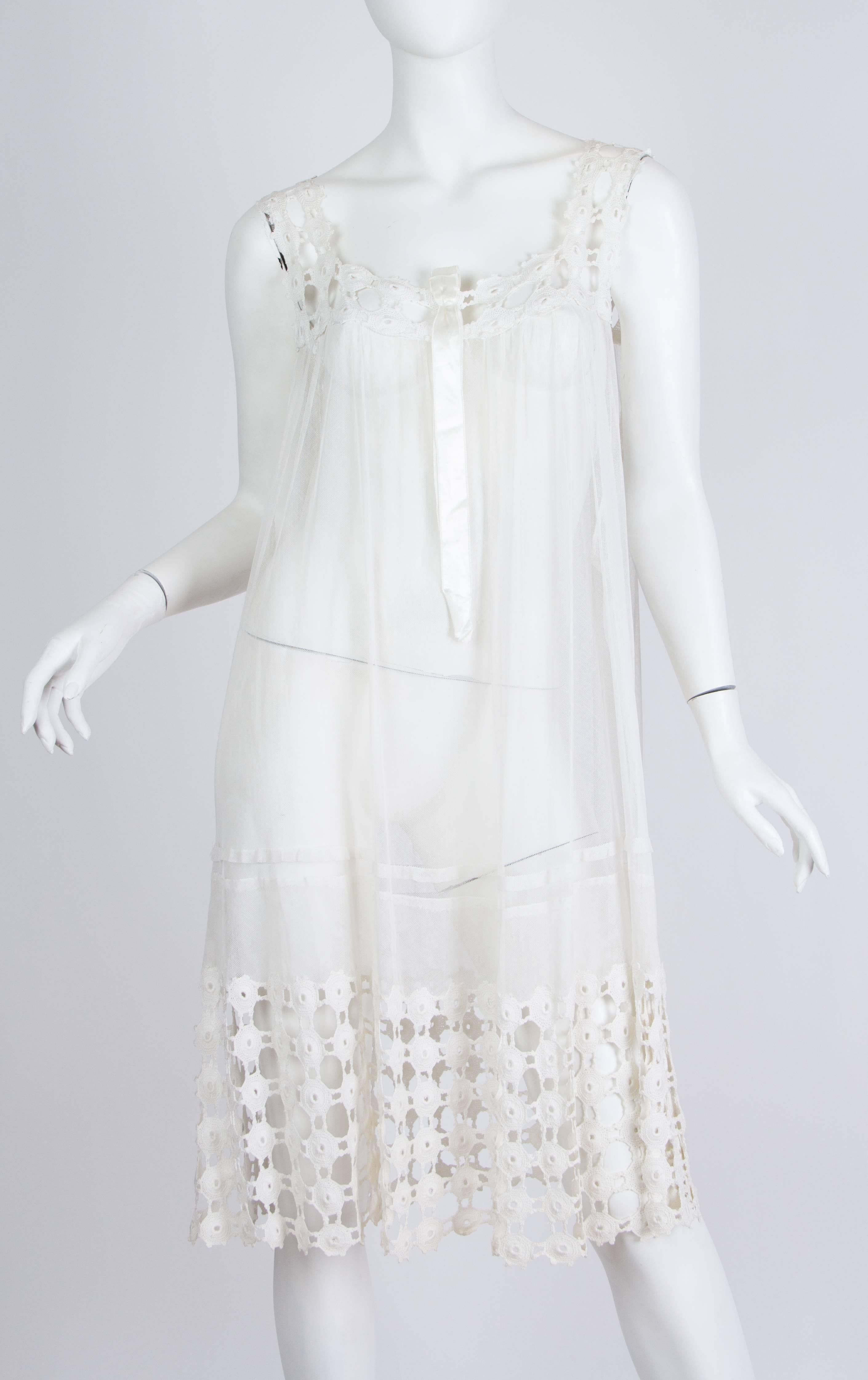 Dress is sheer and would be a great swim cover-up. 100% cotton and very wearable and washable for a piece this age. 