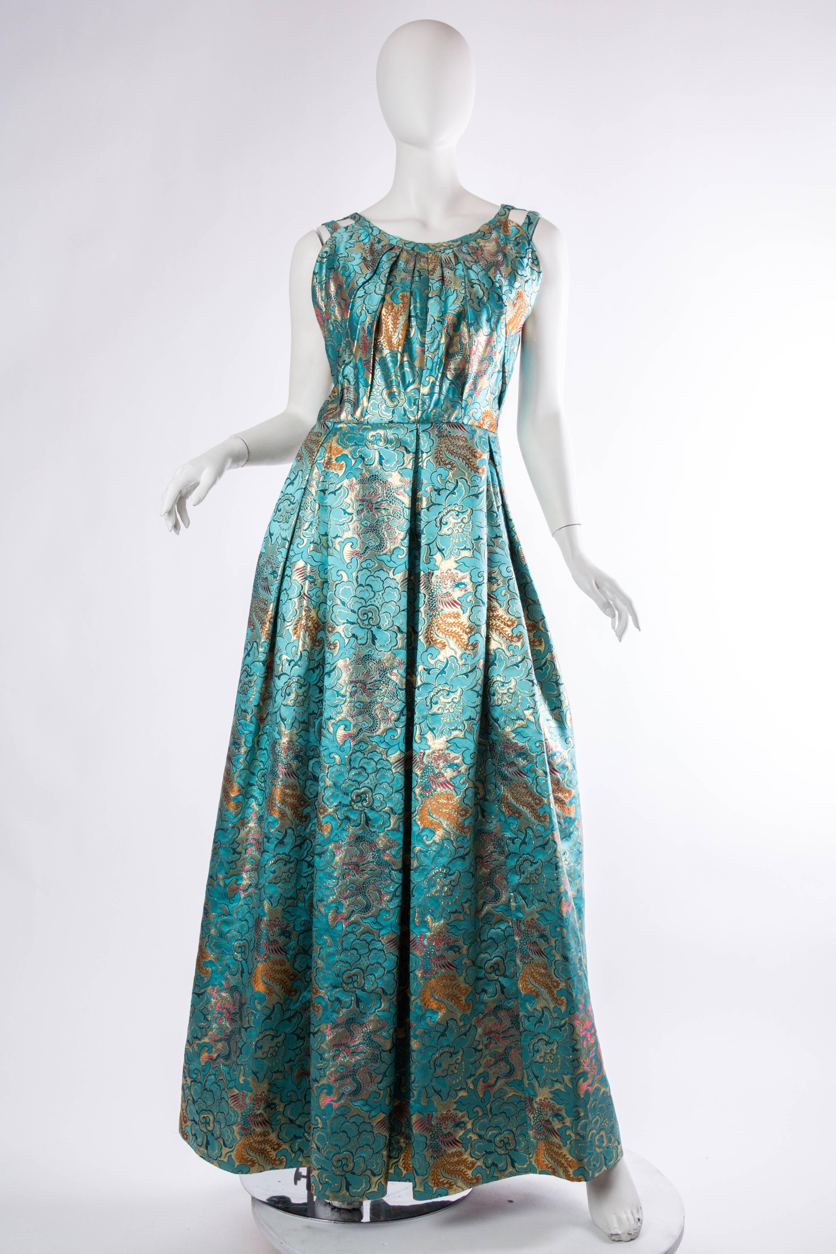MORPHEW COLLECTION Teal & Gold Asian Dragon And Phoenix Jacquard Reversible Gown Made Of 1960S Silk Lamé Fabric
MORPHEW COLLECTION is made entirely by hand in our NYC Ateliér of rare antique materials sourced from around the globe. Our sustainable