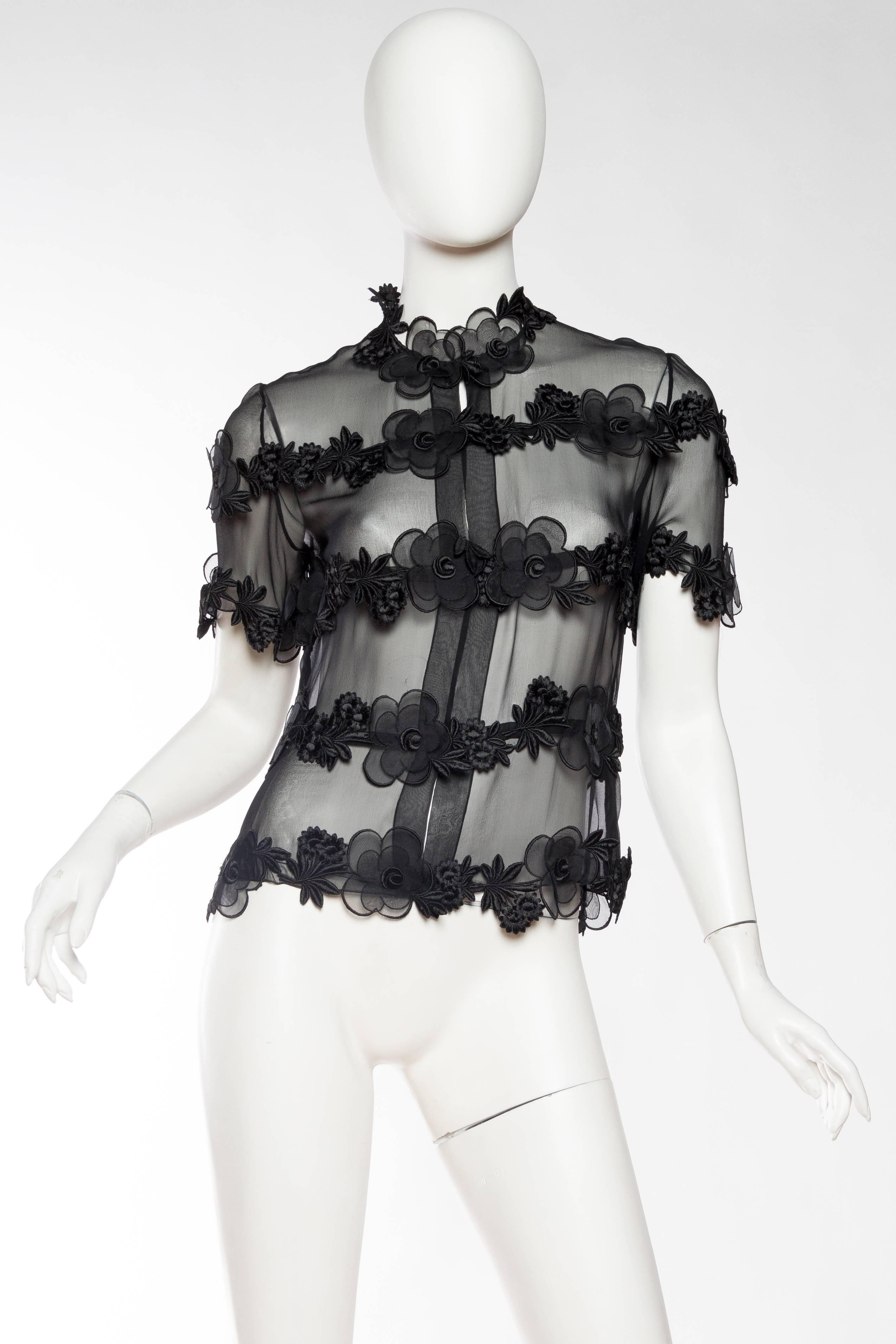 This piece has had the label stolen out of it so we are forced to sell it at a low price half of it's value because of this. The quality alone will assure you however that this piece is surely Chanel. The blouse is made of a sheer chiffon with the