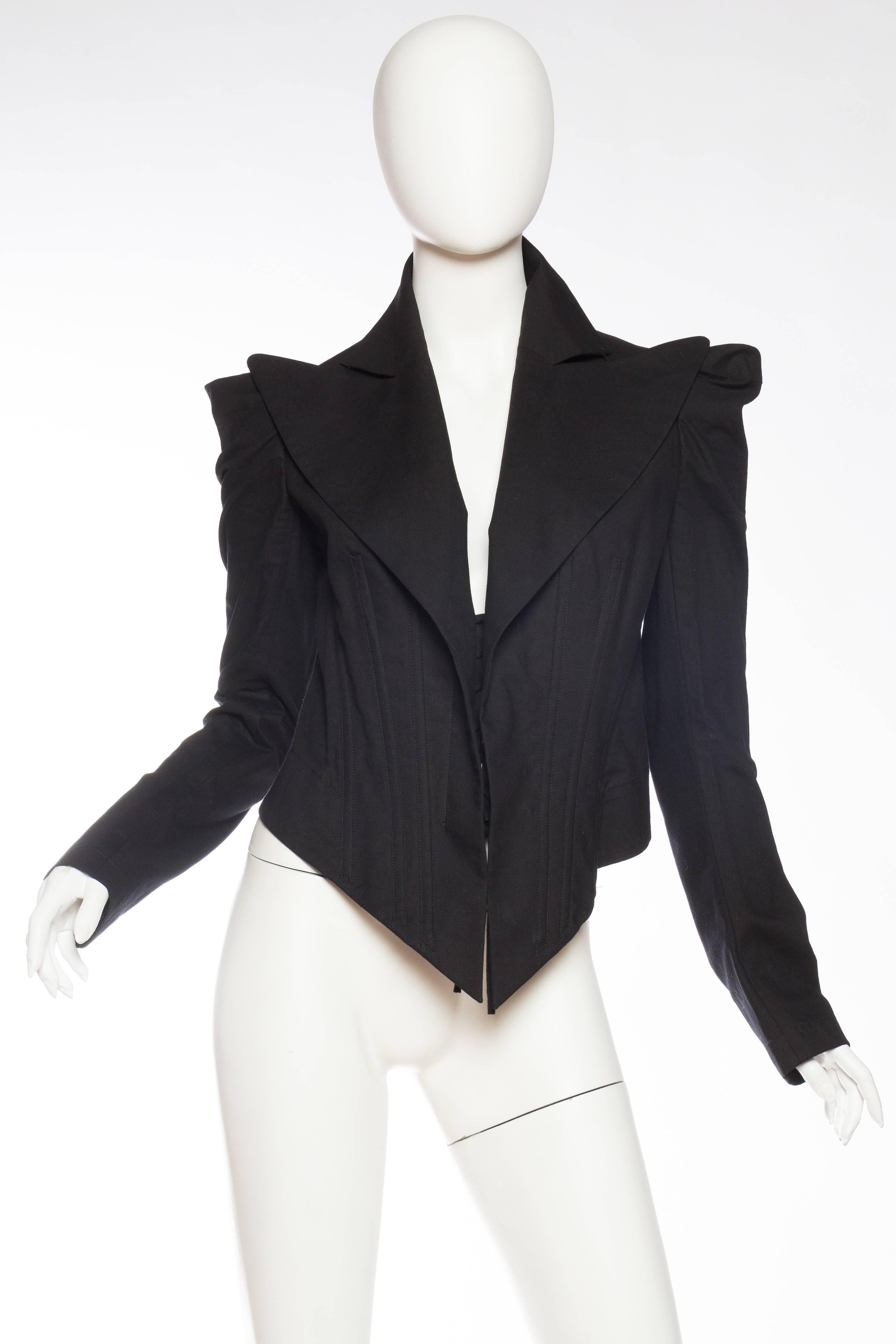 Blazer has winged shoulders, wide lapels and is fully boned like a corset, fits a large size as well as it can be laces tight up the front. 