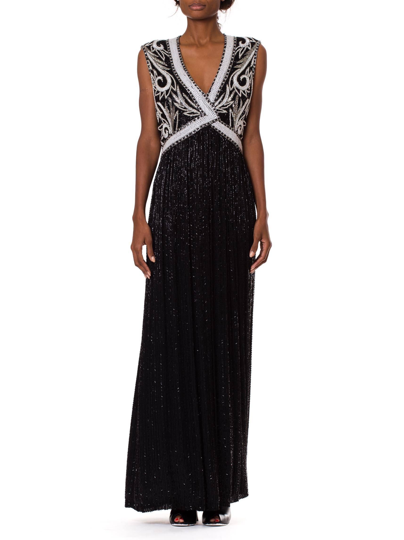This absolutely stunning Bob Mackie evening gown is as elegant as they come. The silhouette has a classic 1930s vibe, with a glittering black skirt and a vest-like bodice encrusted in intricate beadwork. The monochromatic black and white scheme