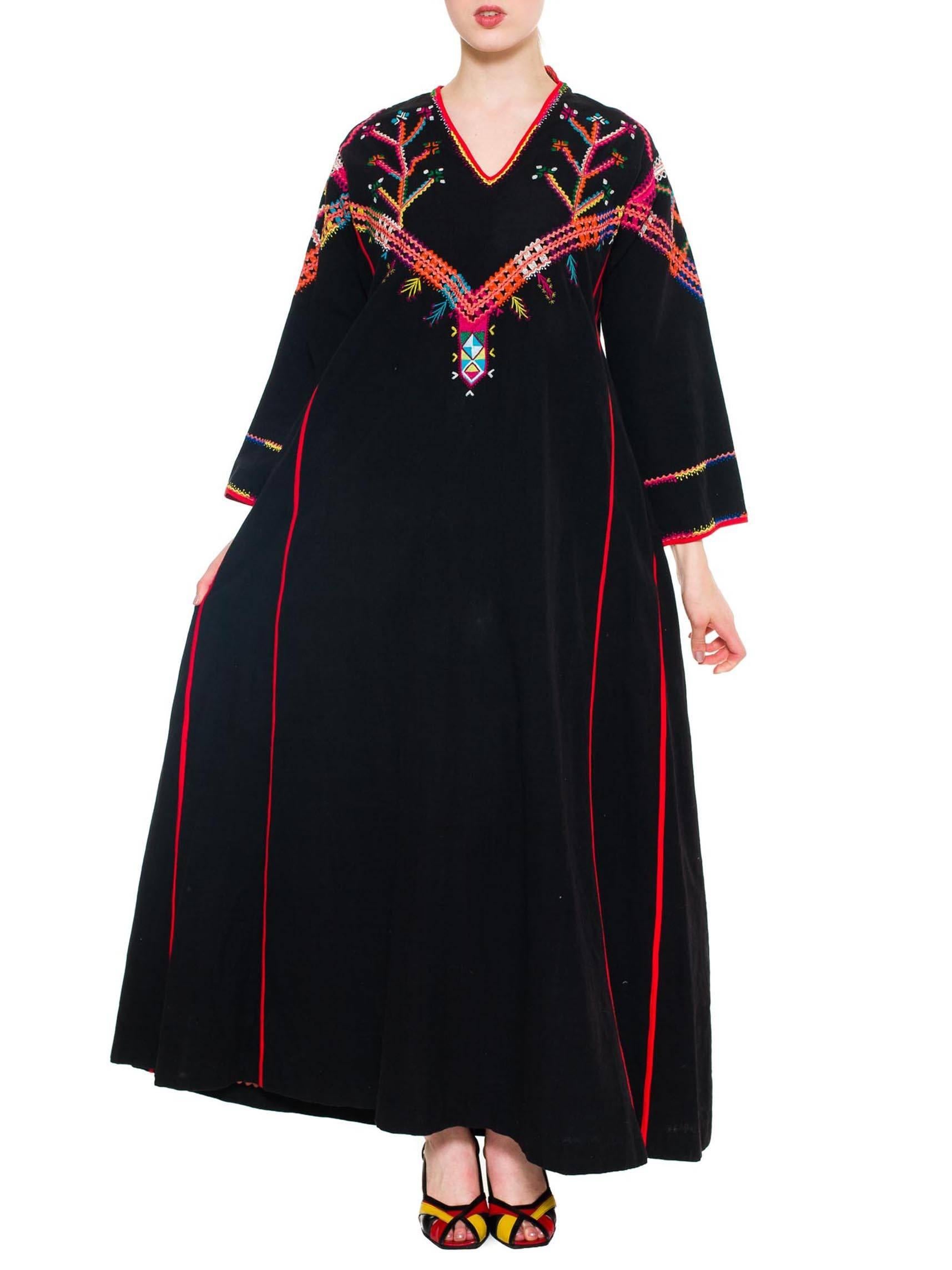 1960S Black Multicolored Powerful Long Embroidered Cloak Kaftan
MORPHEW COLLECTION is made entirely by hand in our NYC Ateliér of rare antique materials sourced from around the globe. Our sustainable vintage materials represent over a century of