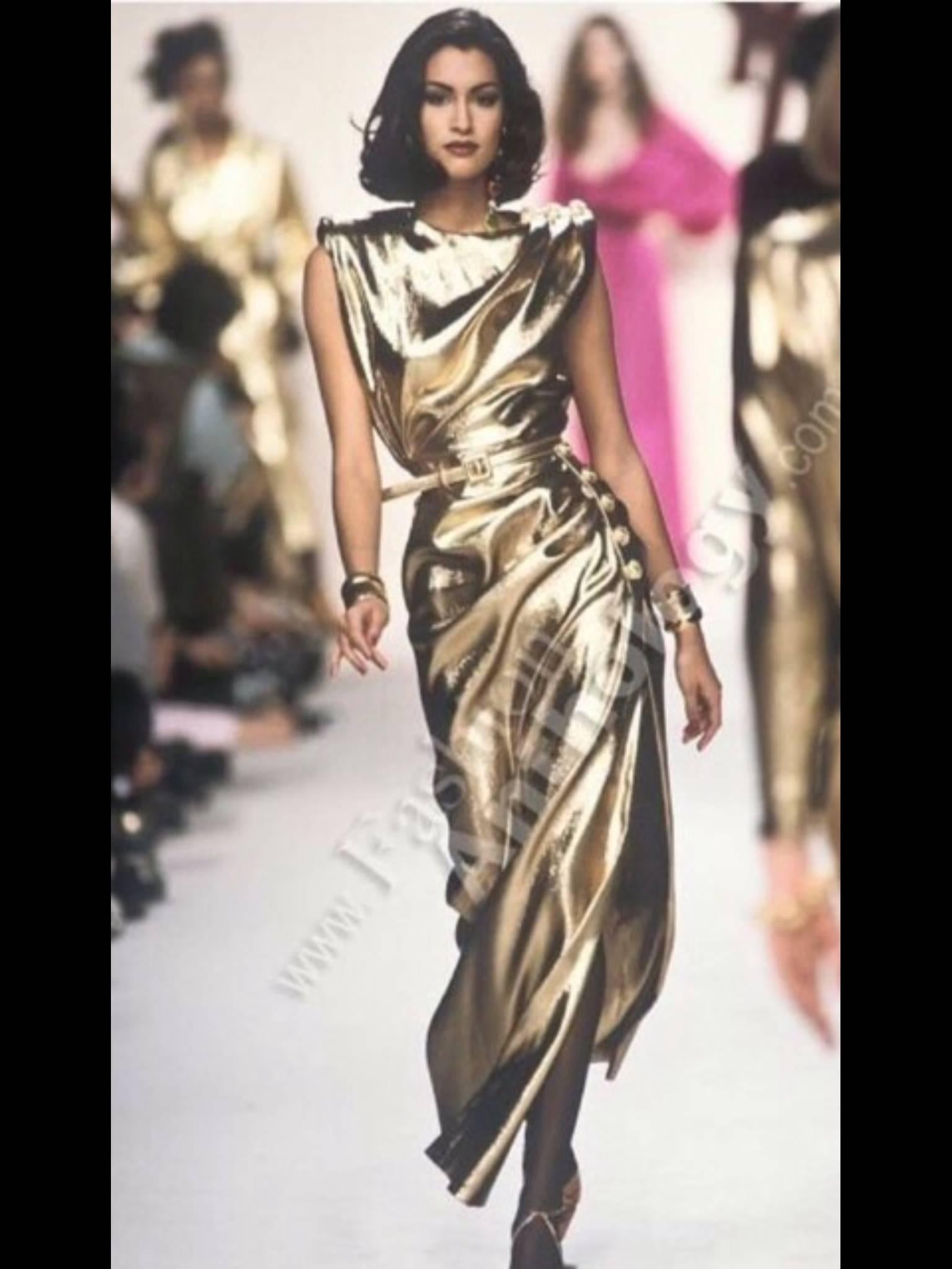 Beautiful liquid gold lamé pleated and gathered to maximize the shine and drape of this column gown. 