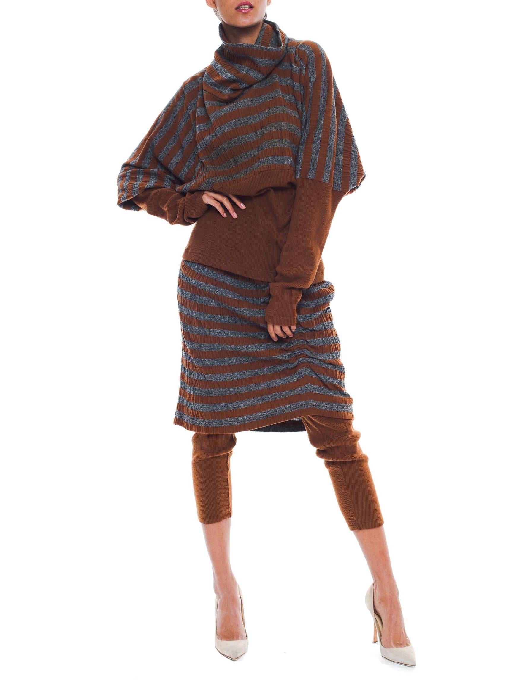 This is a matching knitwear set from famed Japanese designer Issey Miyake. In shades of burnt orange and grey, it is perfect for fall. Everyone knows that autumn is the best season for fashionable layers, and this set is made for it. The top is cut