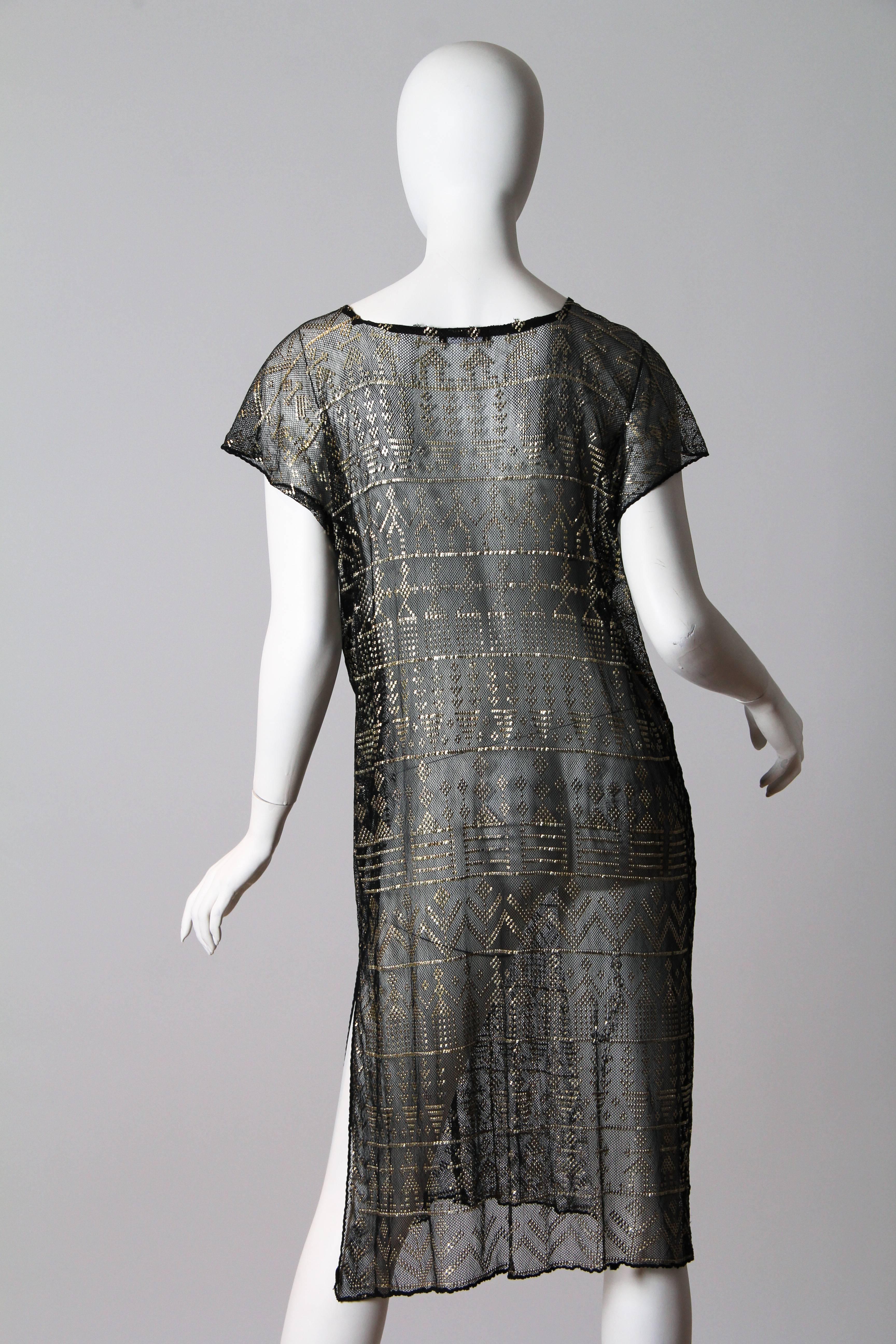 Hammered silver adorns the cotton net on this piece from the Art Deco era. Egyptian goods were quite in demand and these shawls were a luxury commodity. A lady with added hutzpah had hers made into a dress such as this one. These shawls were