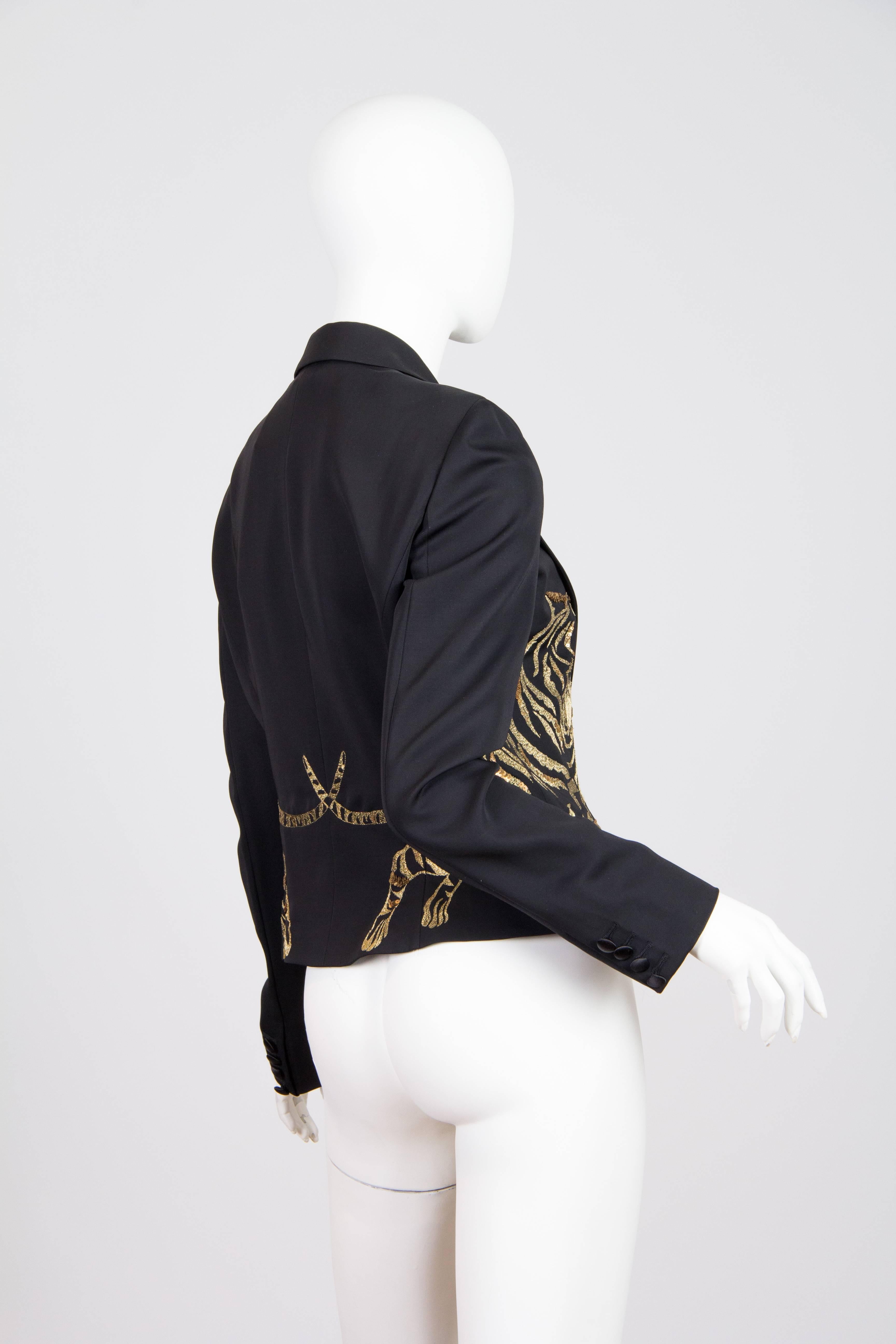 Alexander McQueen Perfect fitted black jacket from fall 2007. A pair of leaping tigers sets off the waistline of this jacket. The added sequins and crystals accent the embroidery, taking it next level as McQueen always did.
